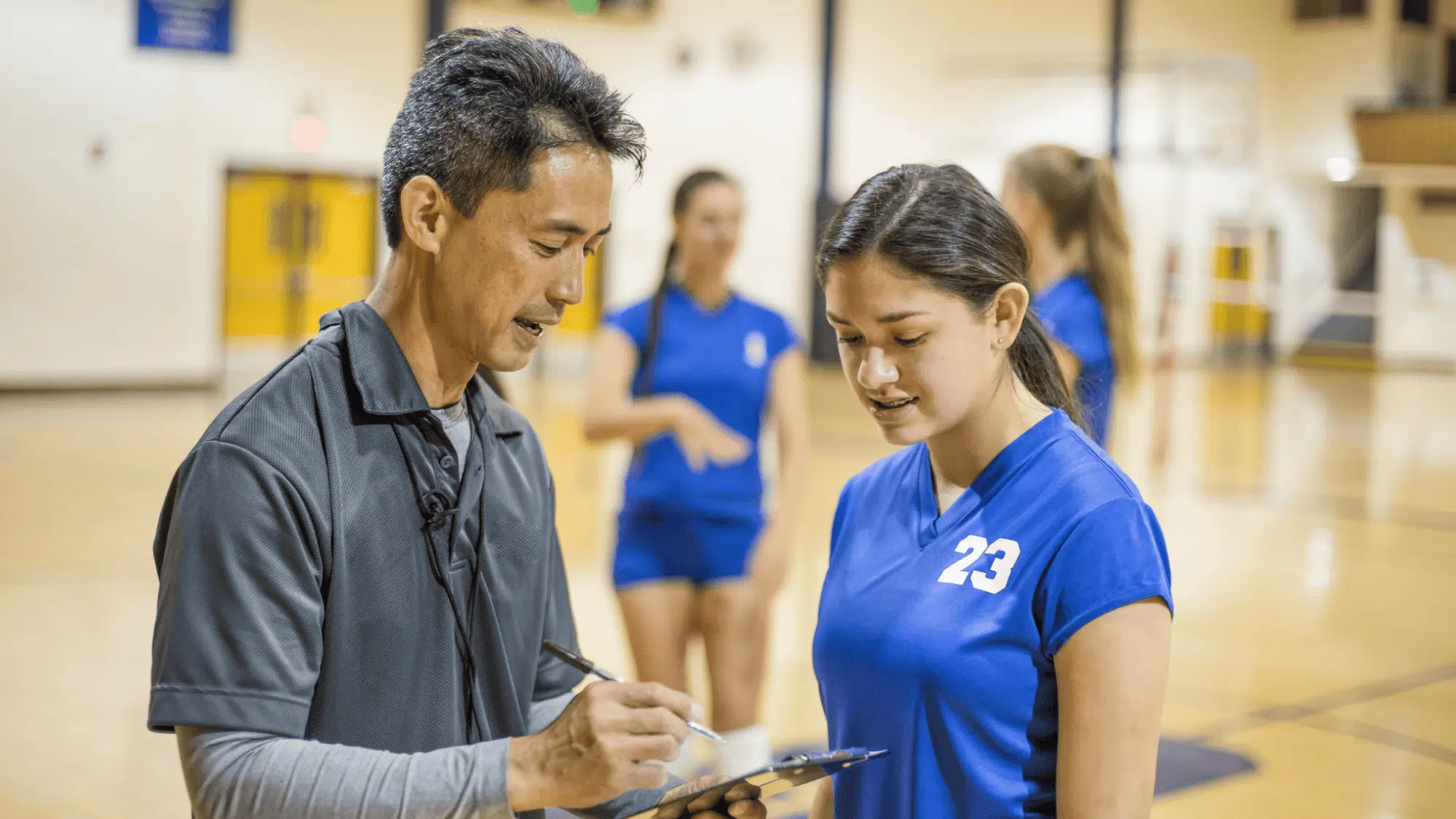 a coach telling about player specific practice strategy to his team player individually