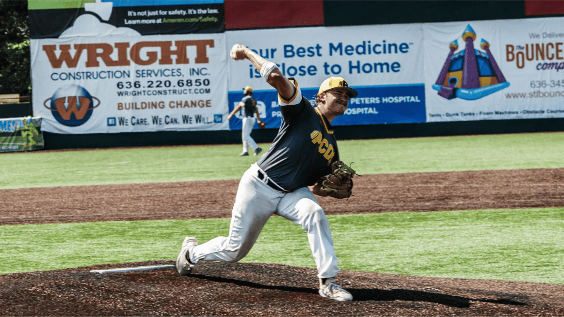 baseball pitcher throwing pitch on mound