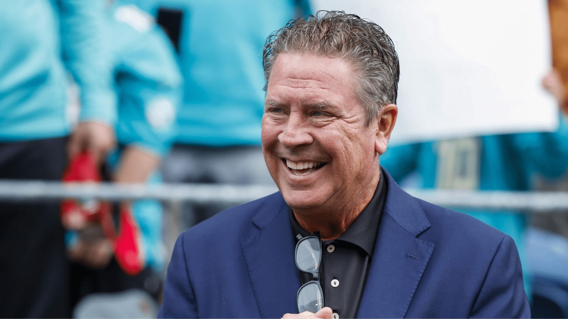 dan marino confidence and smile in his blue coat