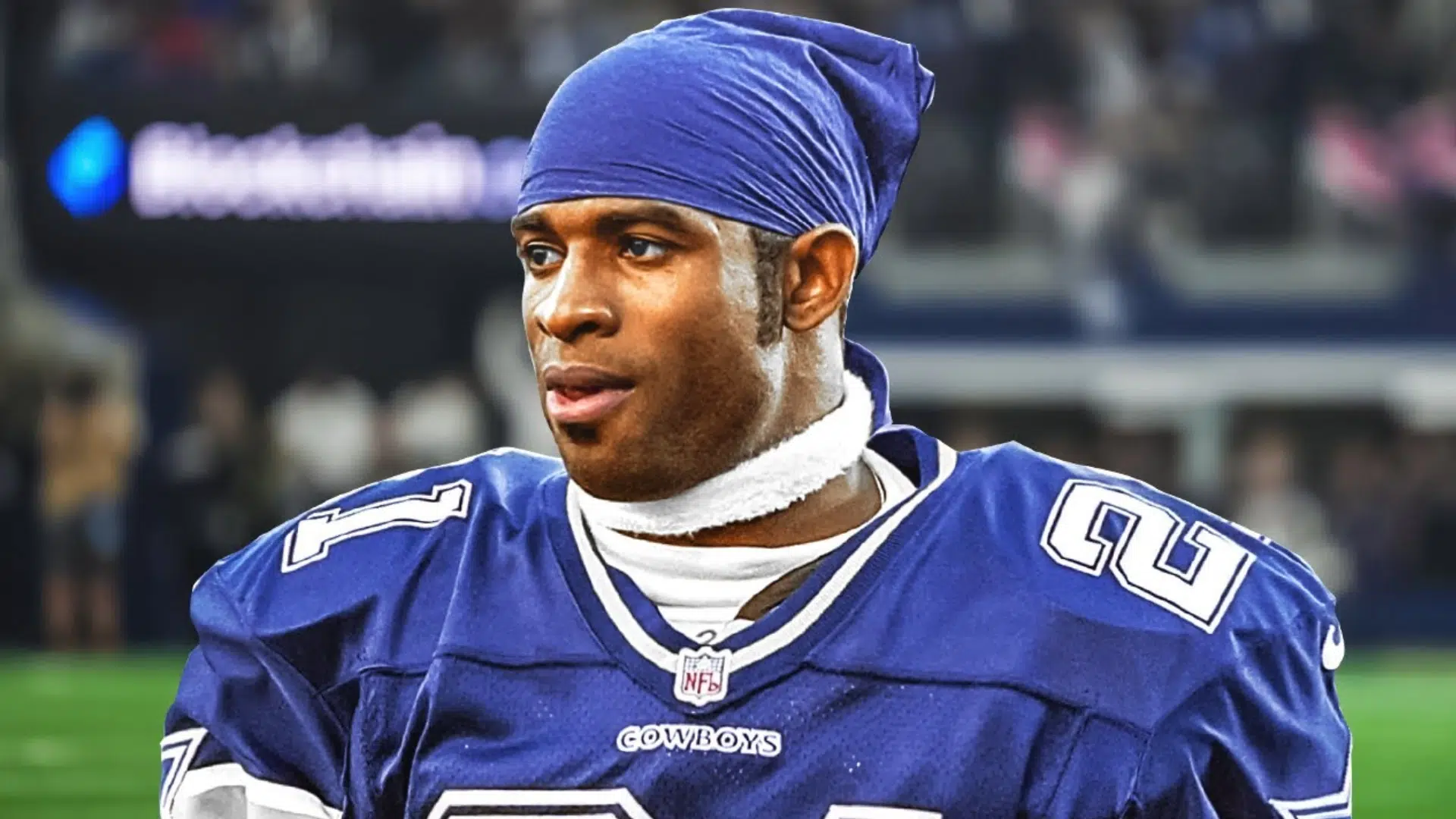 deion sanders a defensive back player in a blue jersey standing on field during game