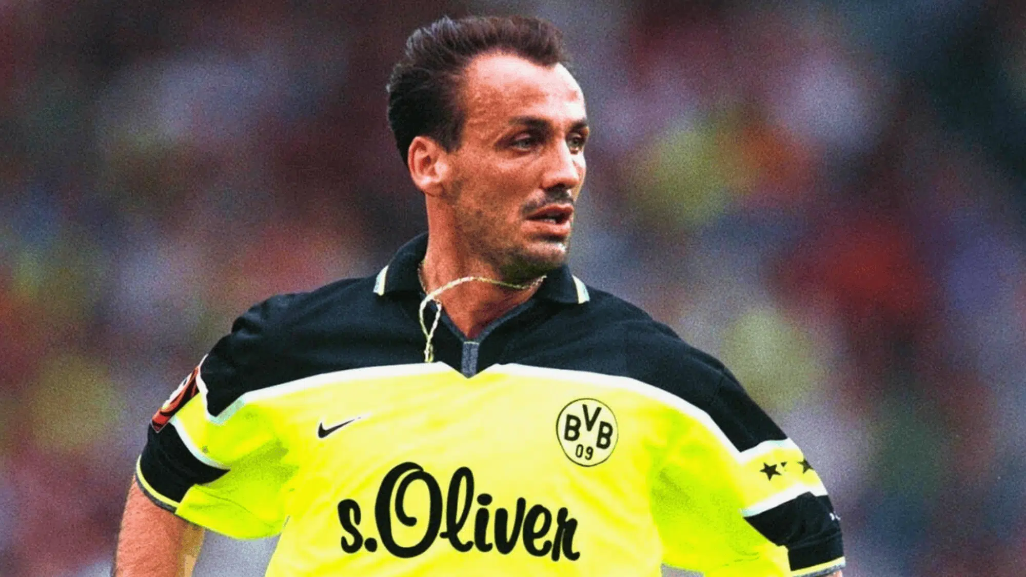jürgen kohler with a unique yellow and black kit focused during a match