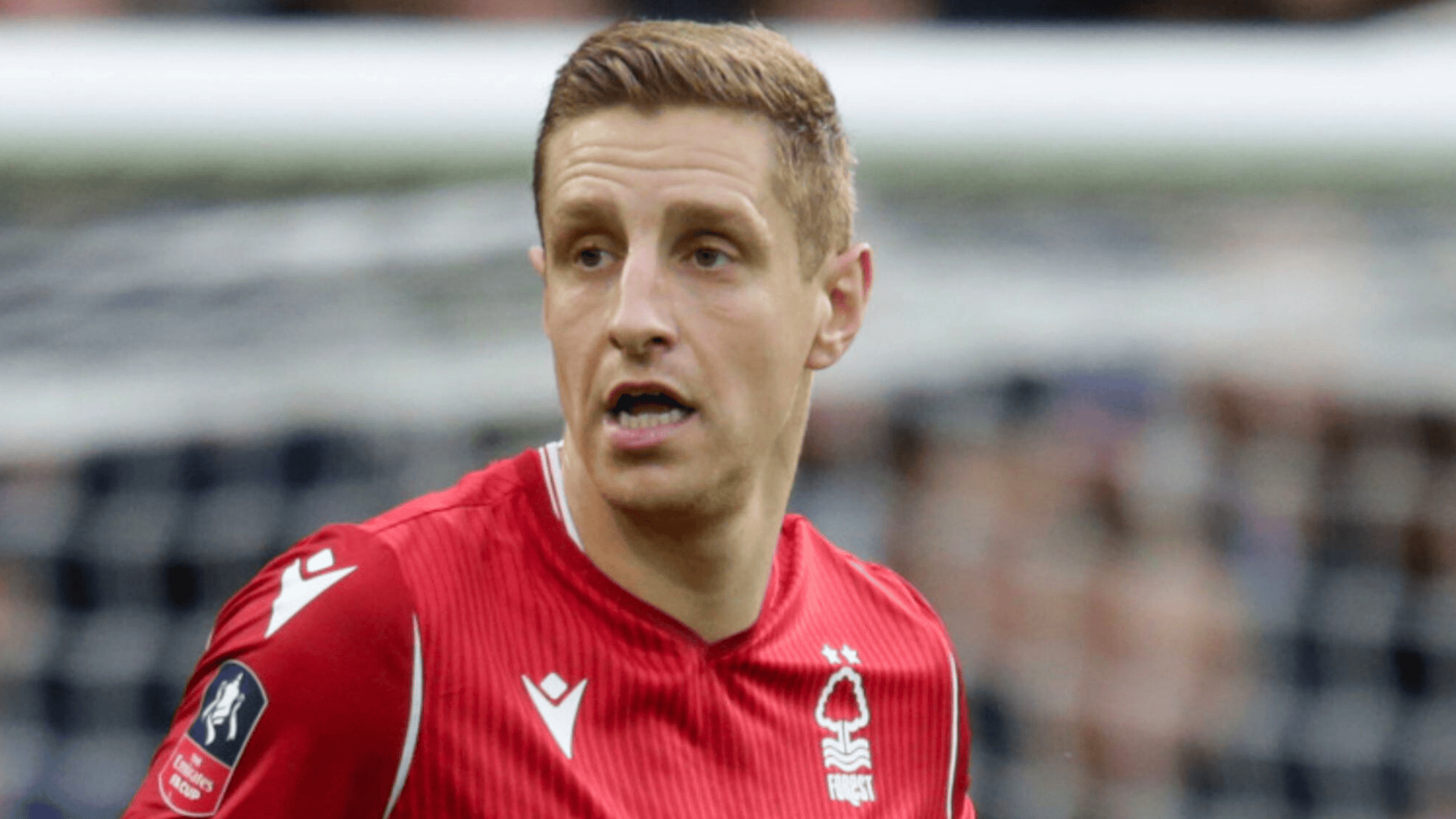 michael dawson in a red nottingham forest jersey during a match