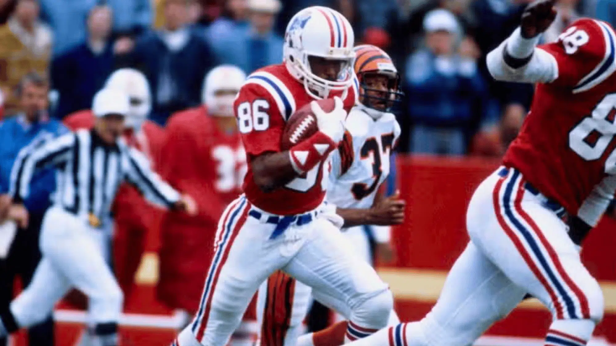 new england patriots player darryl stingley wearing number 86 runs with the football during a game