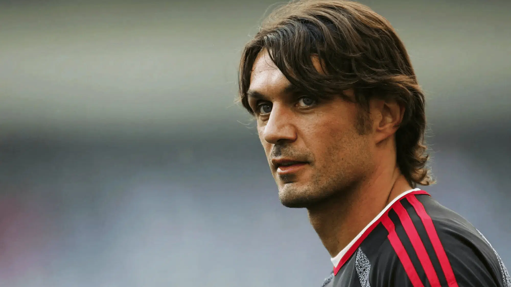 paolo maldini in an ac milan jersey looking to the side during a match