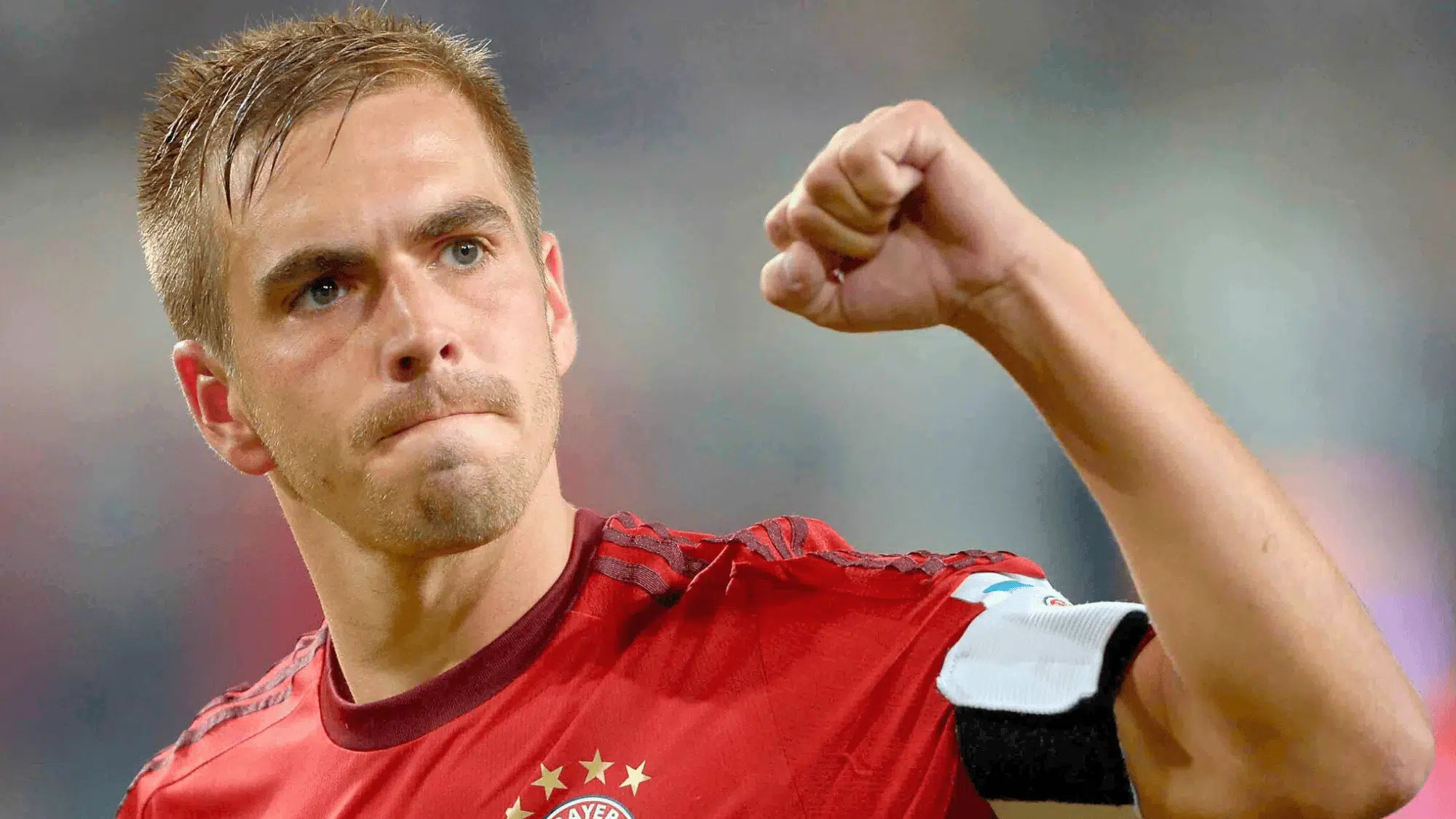 philipp lahm making a fist pump in celebration during a match