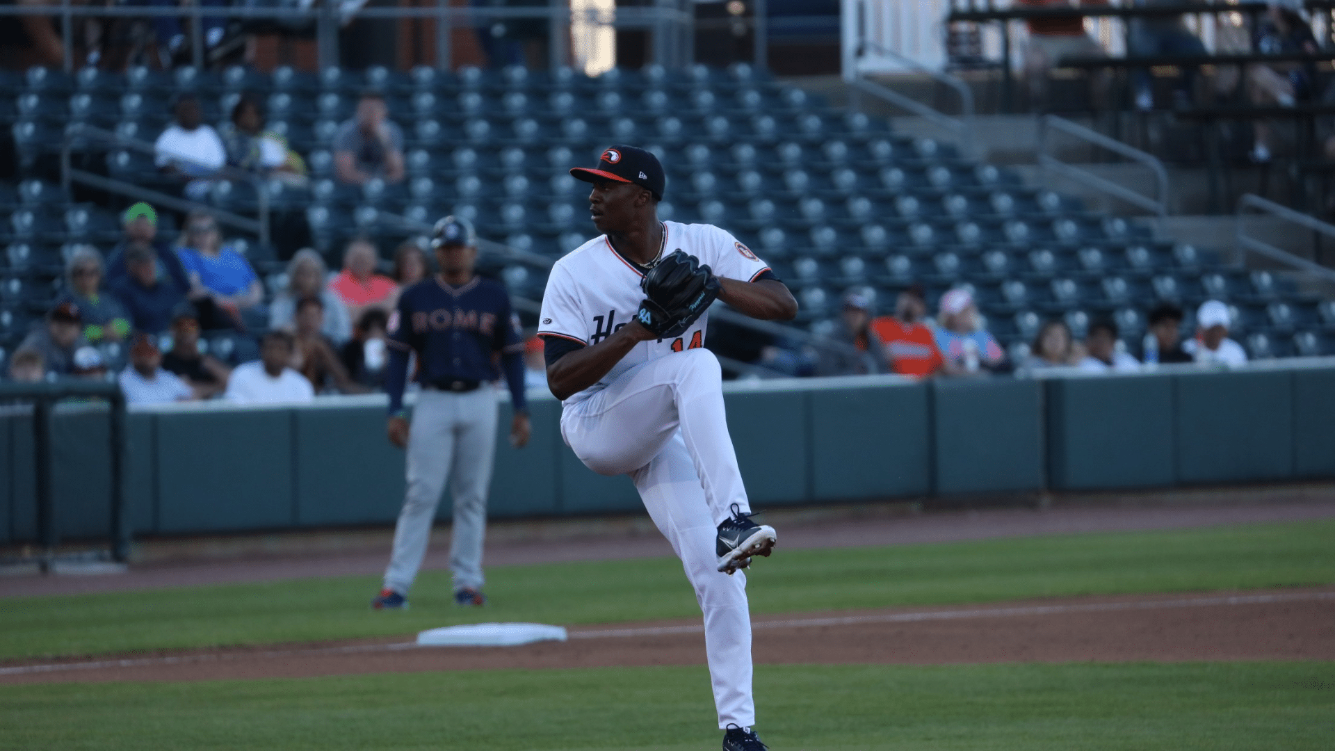 pitcher preparing to throw baseball pitch