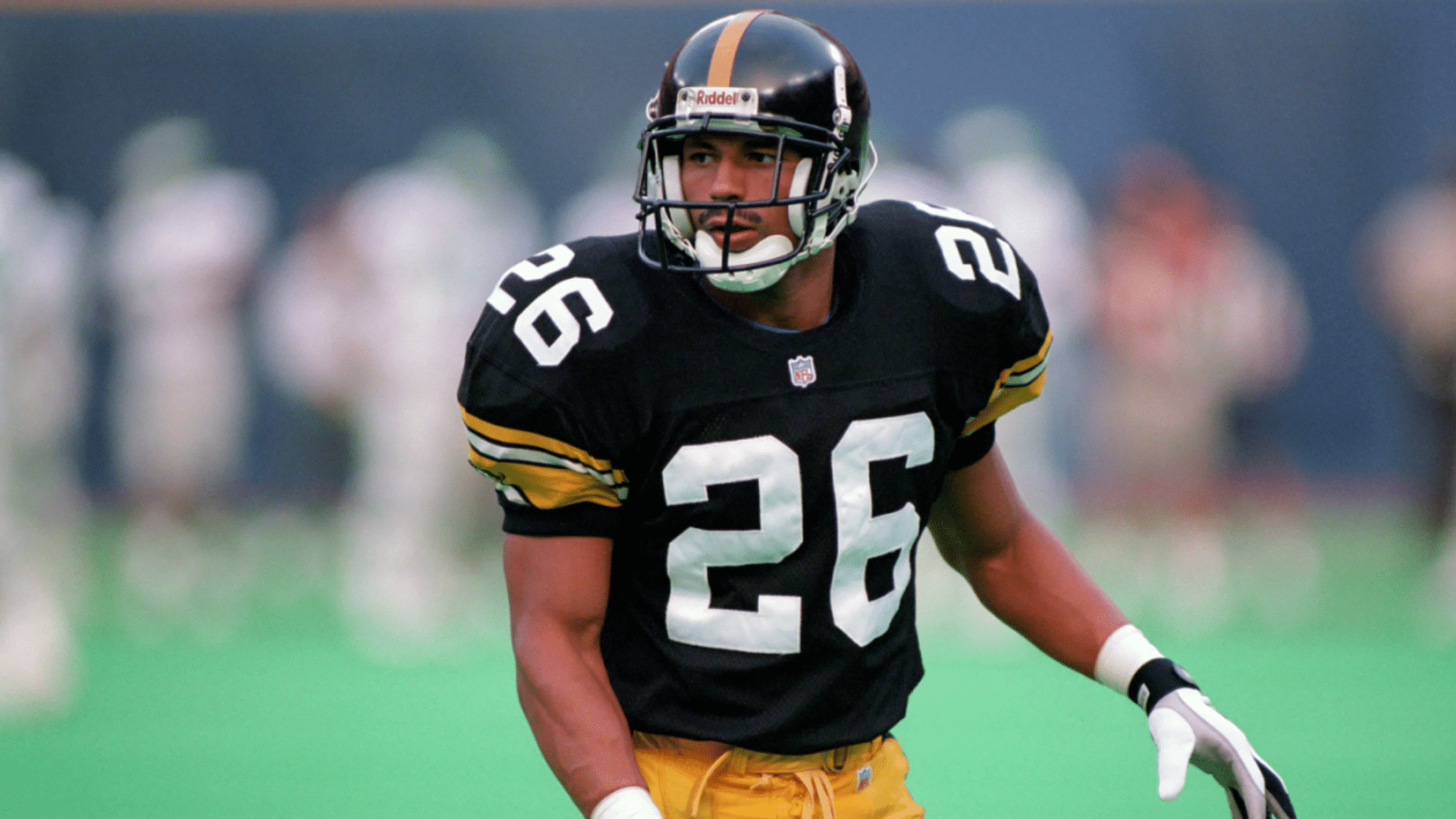 rod woodson a defensive back player in black and gold uniform lined up on field before play showing whats a db football role