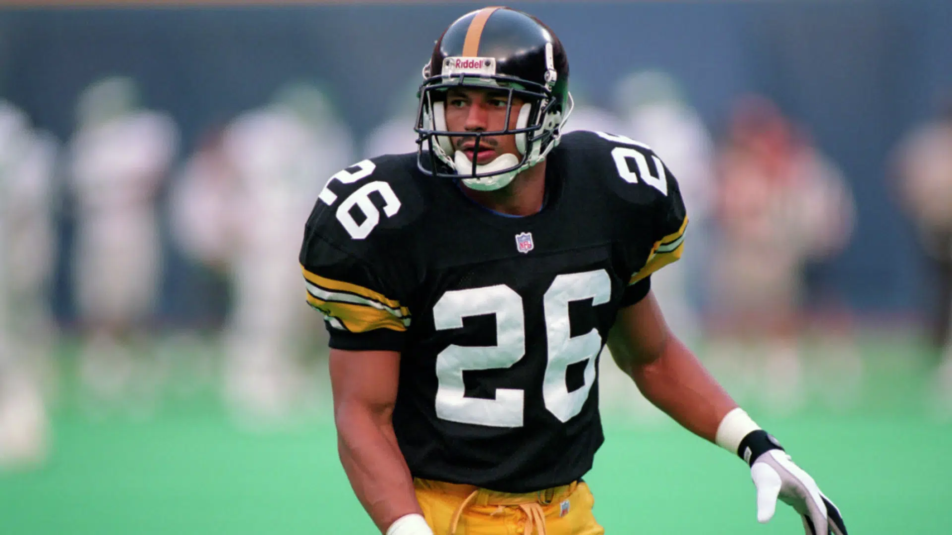 rod woodson a defensive back player in black and gold uniform lined up on field before play showing whats a db football role