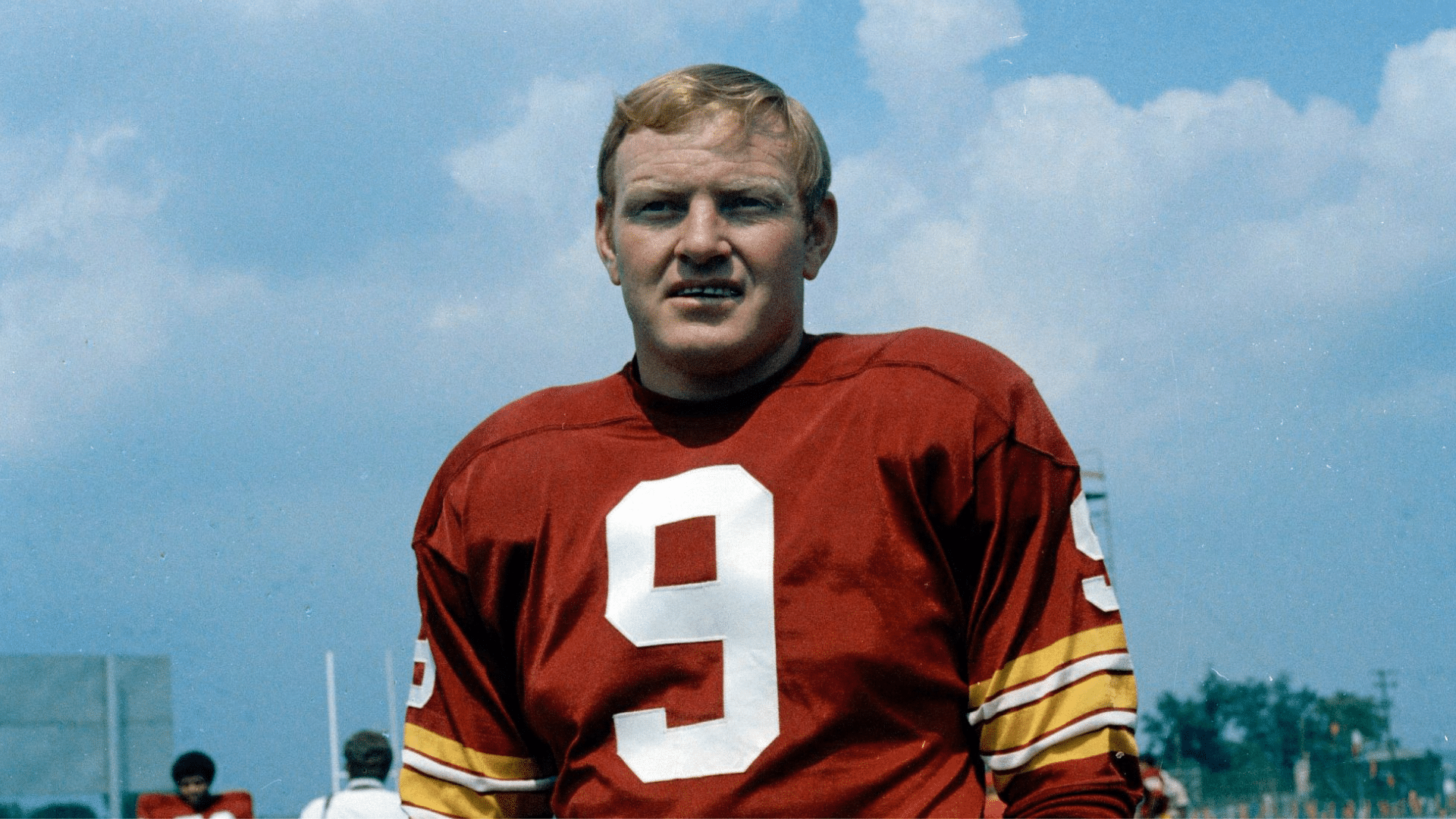 sonny jurgernsen vintage football player stands in uniform on the field