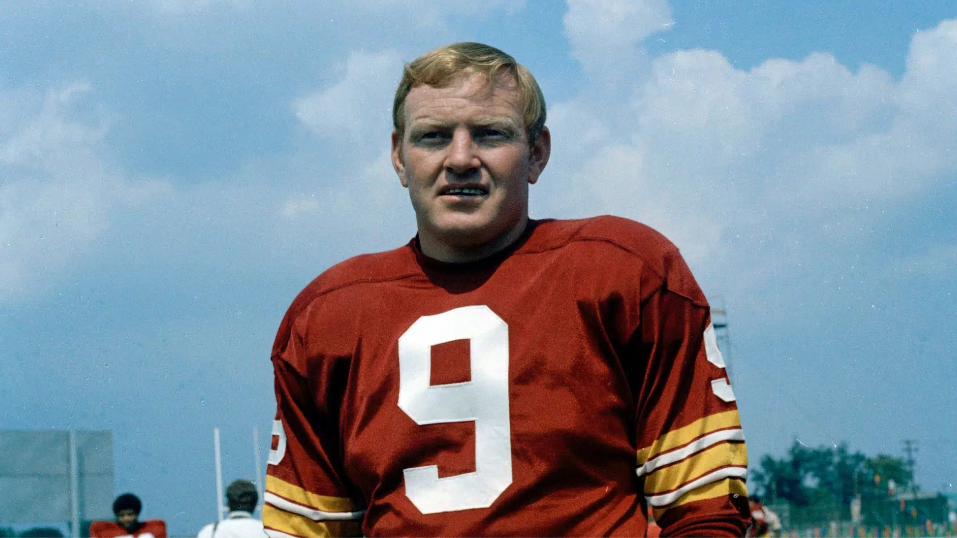sonny jurgernsen vintage football player stands in uniform on the field
