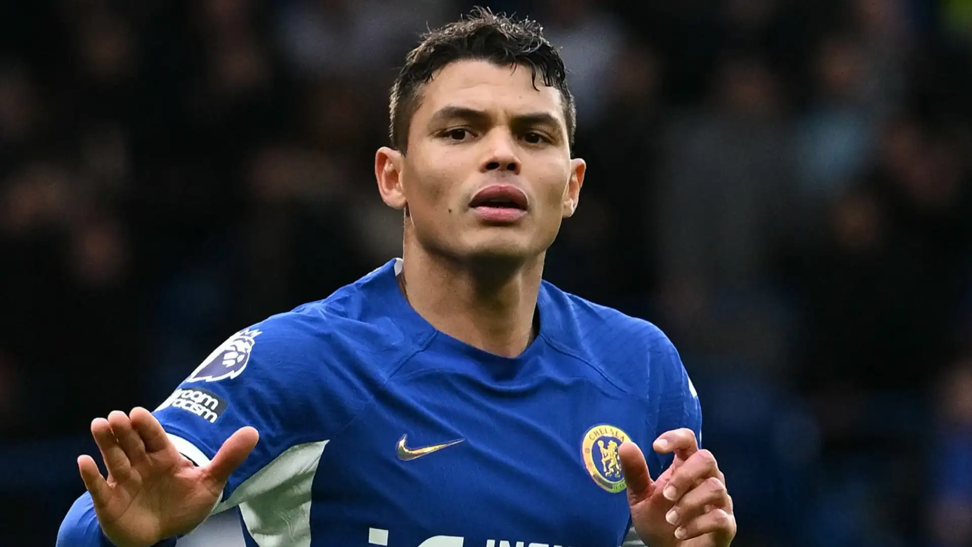 thiago silva in a blue chelsea jersey gesturing during a match