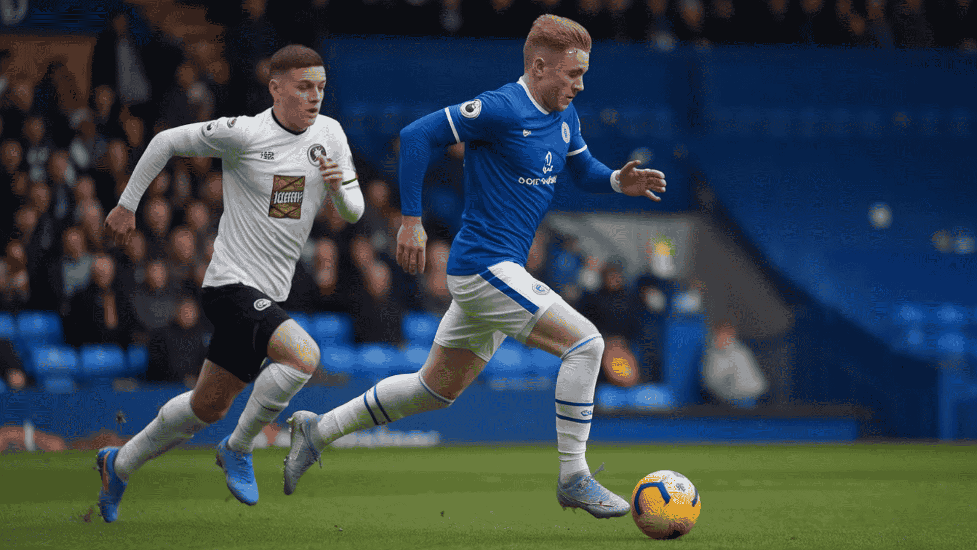 two football player running after a foootball to score the goal during a competitive match