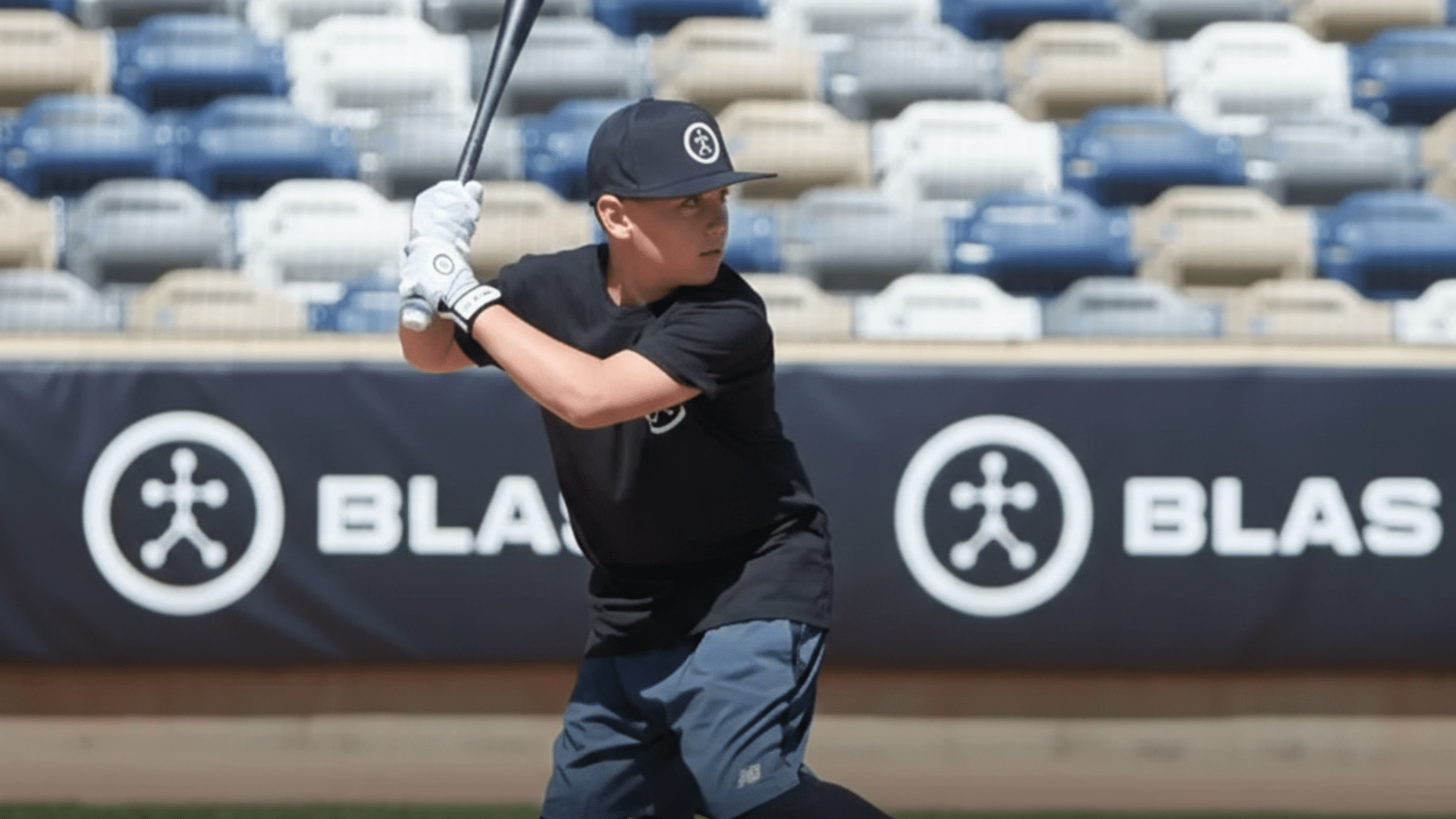 young baseball player ready to swing on the field