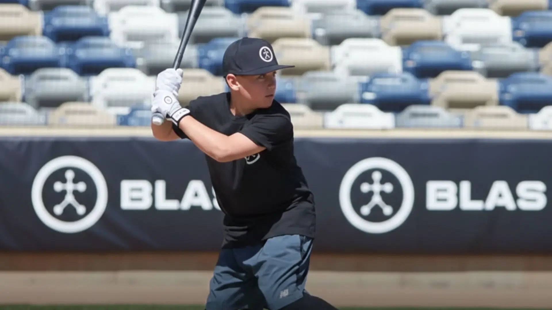 young baseball player ready to swing on the field