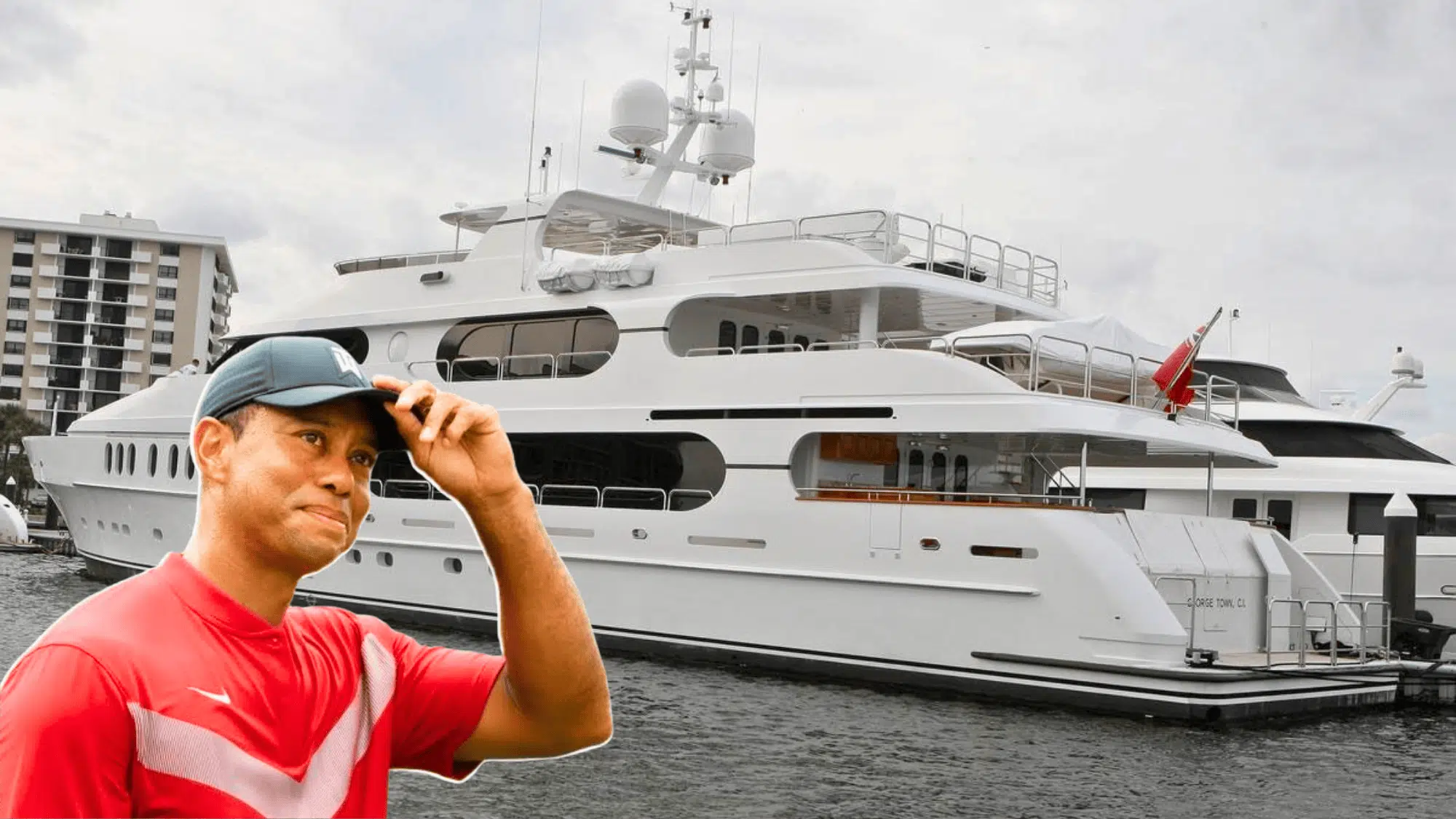 Tiger Woods Yacht man in red shirt adjusting cap standing in front of large white luxury yacht docked on water