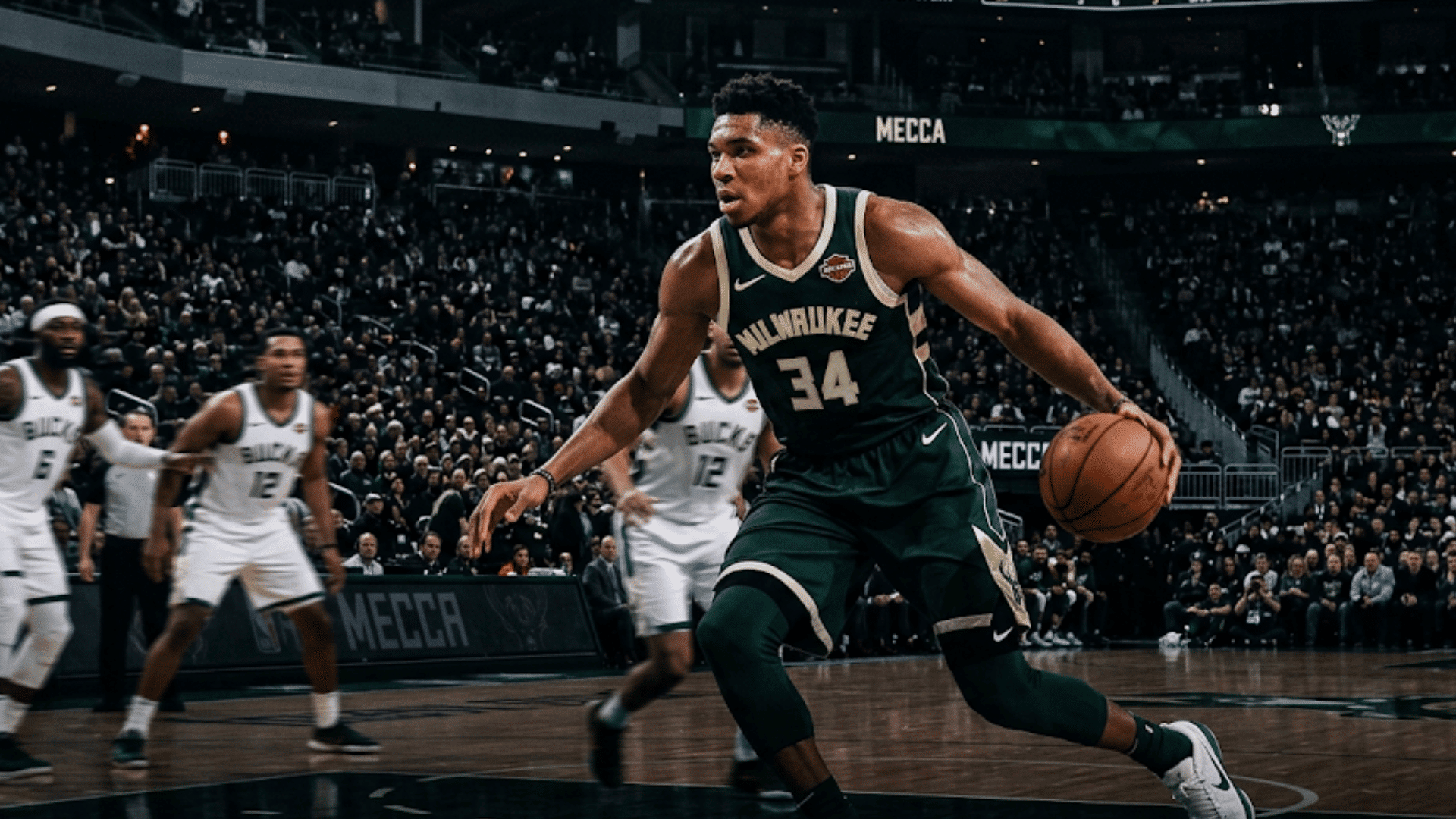 basketball player in green jersey dribbling ball during game in arena