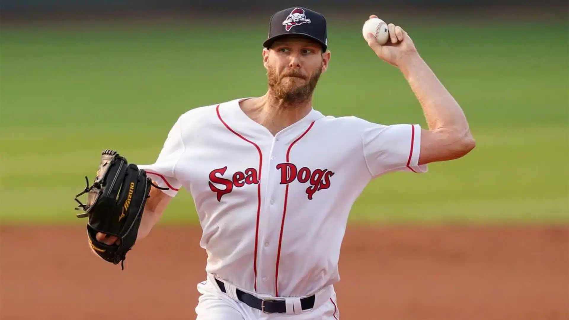chris sale one of the oldest active mlb players pitching baseball wearing sea dogs uniform on field