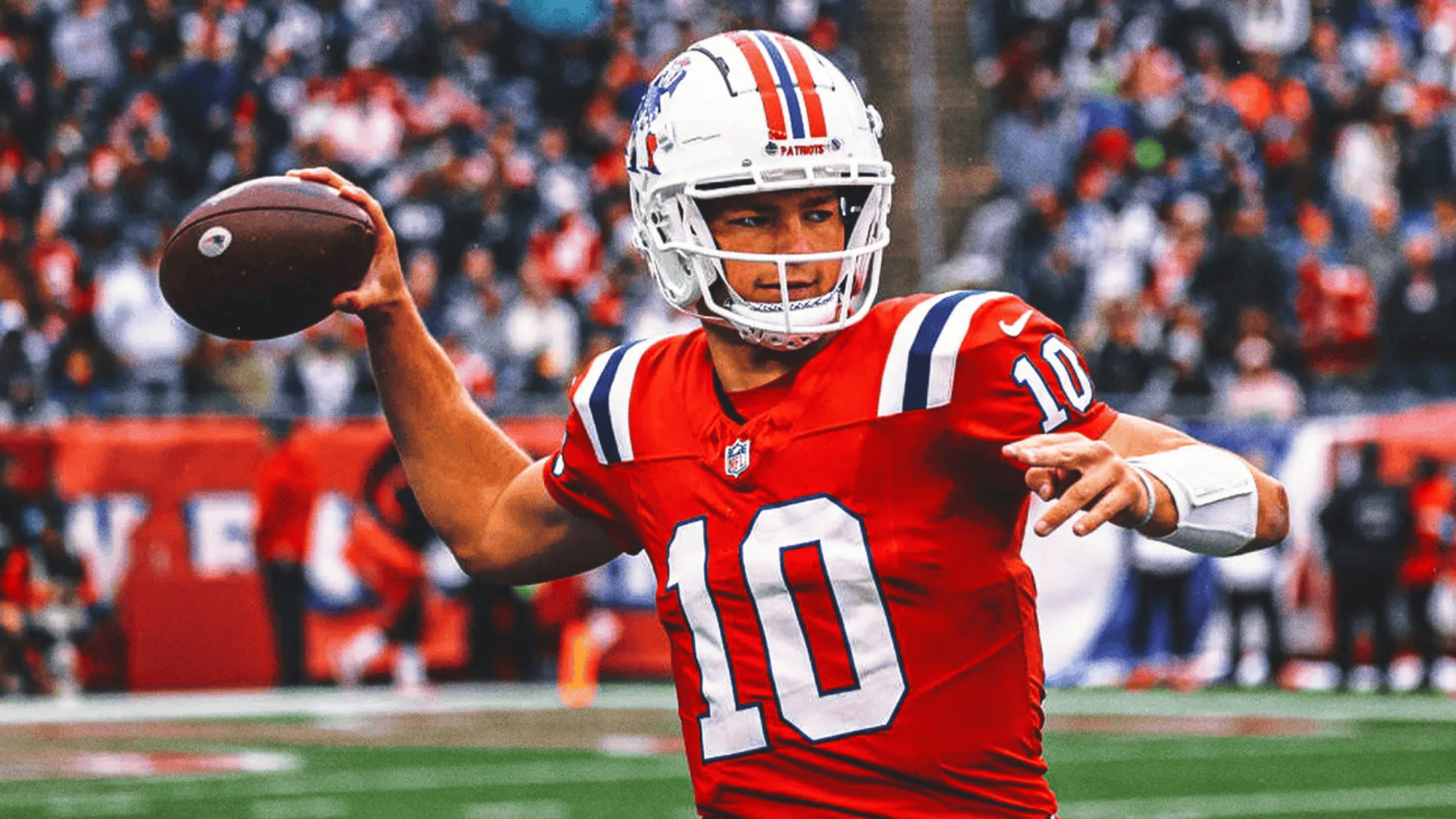 drake maye in a red jersey number 10 prepares to throw a football on a field