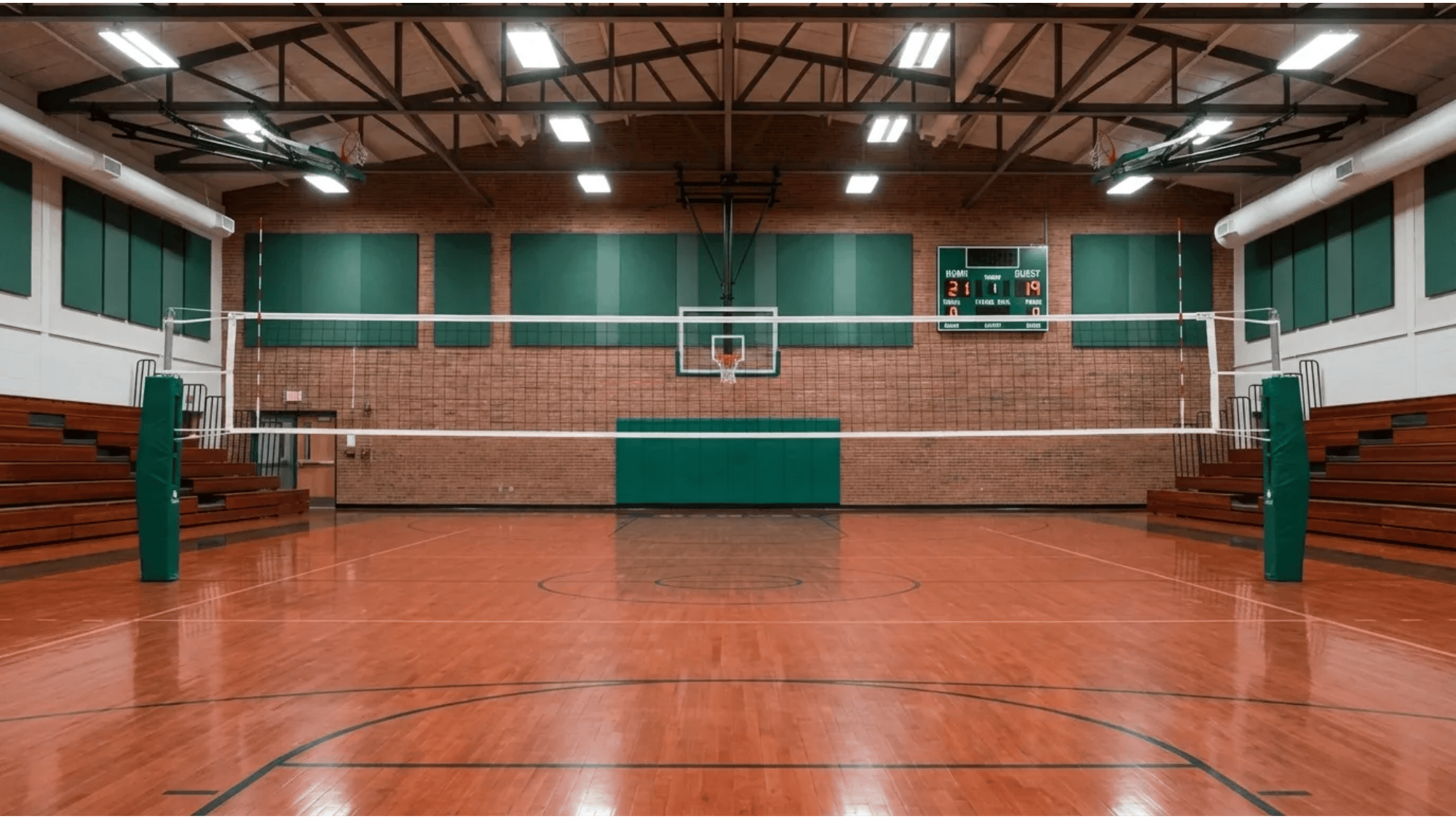 empty indoor volleyball court with net wooden floor scoreboard and bleachers inside gym volleyball court dimensions