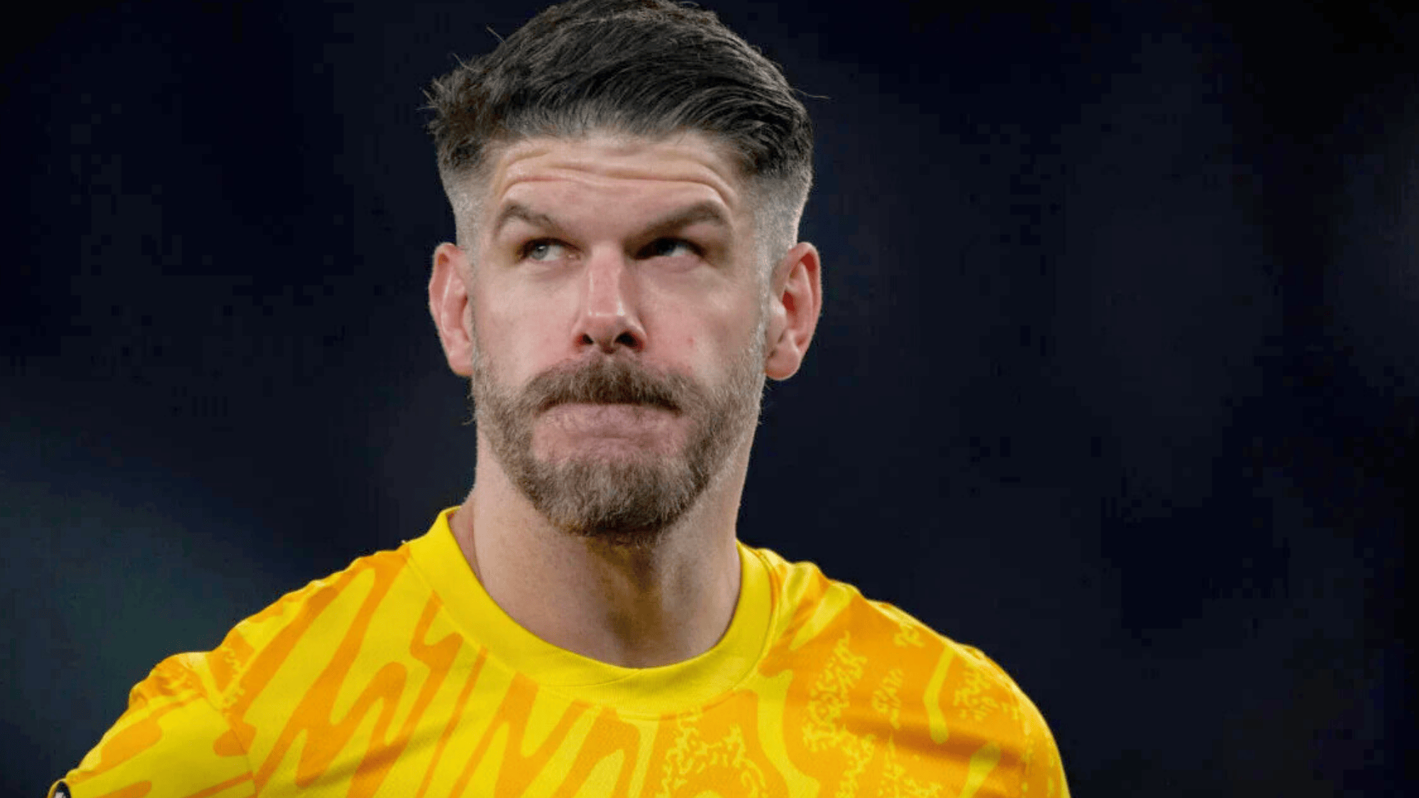 fraser forster is wearing a yellow kit with a modern design probably playing for tottenham hotspur