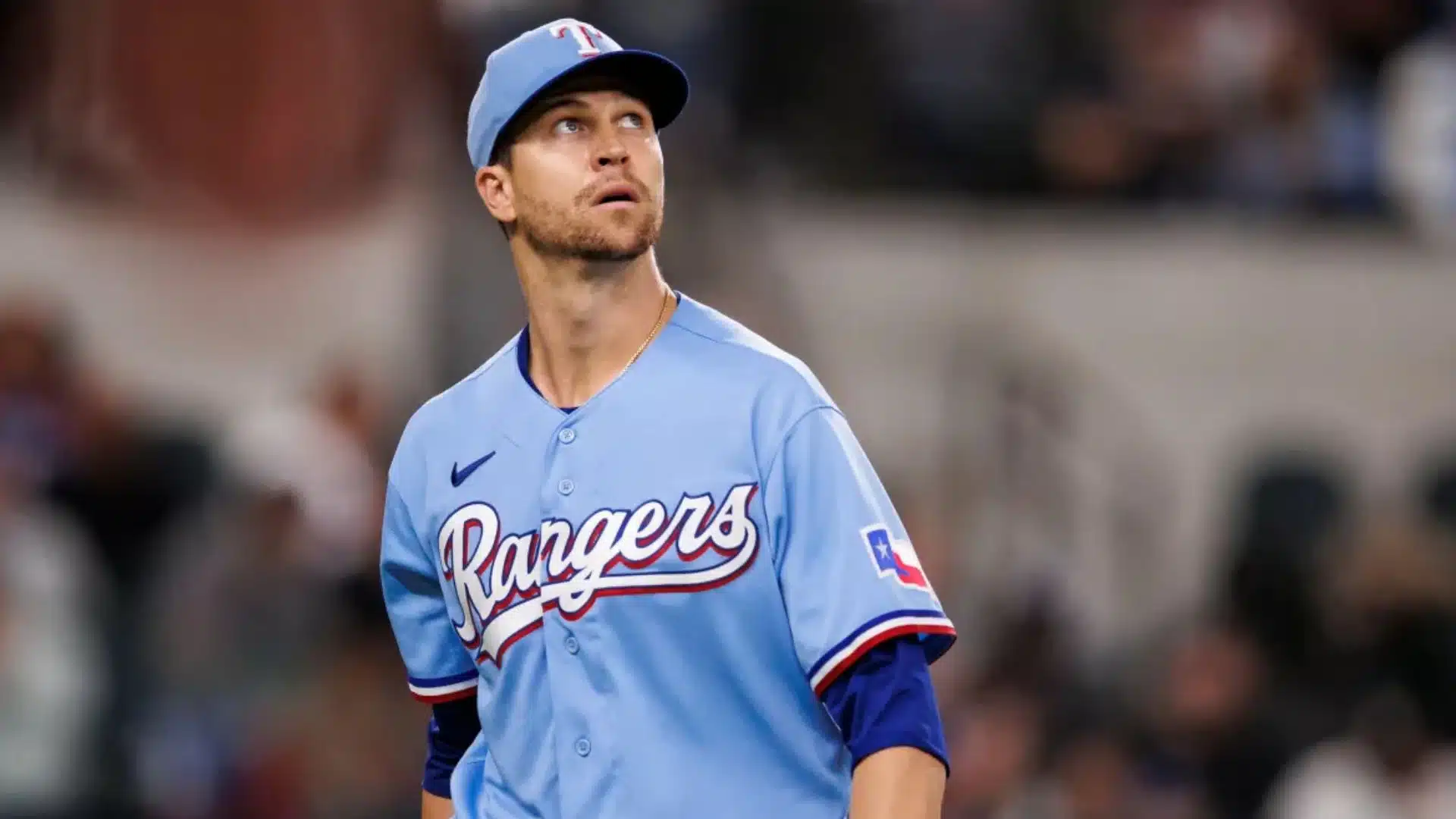 jacob degrom among oldest active mlb players looking up during game wearing light blue rangers uniform