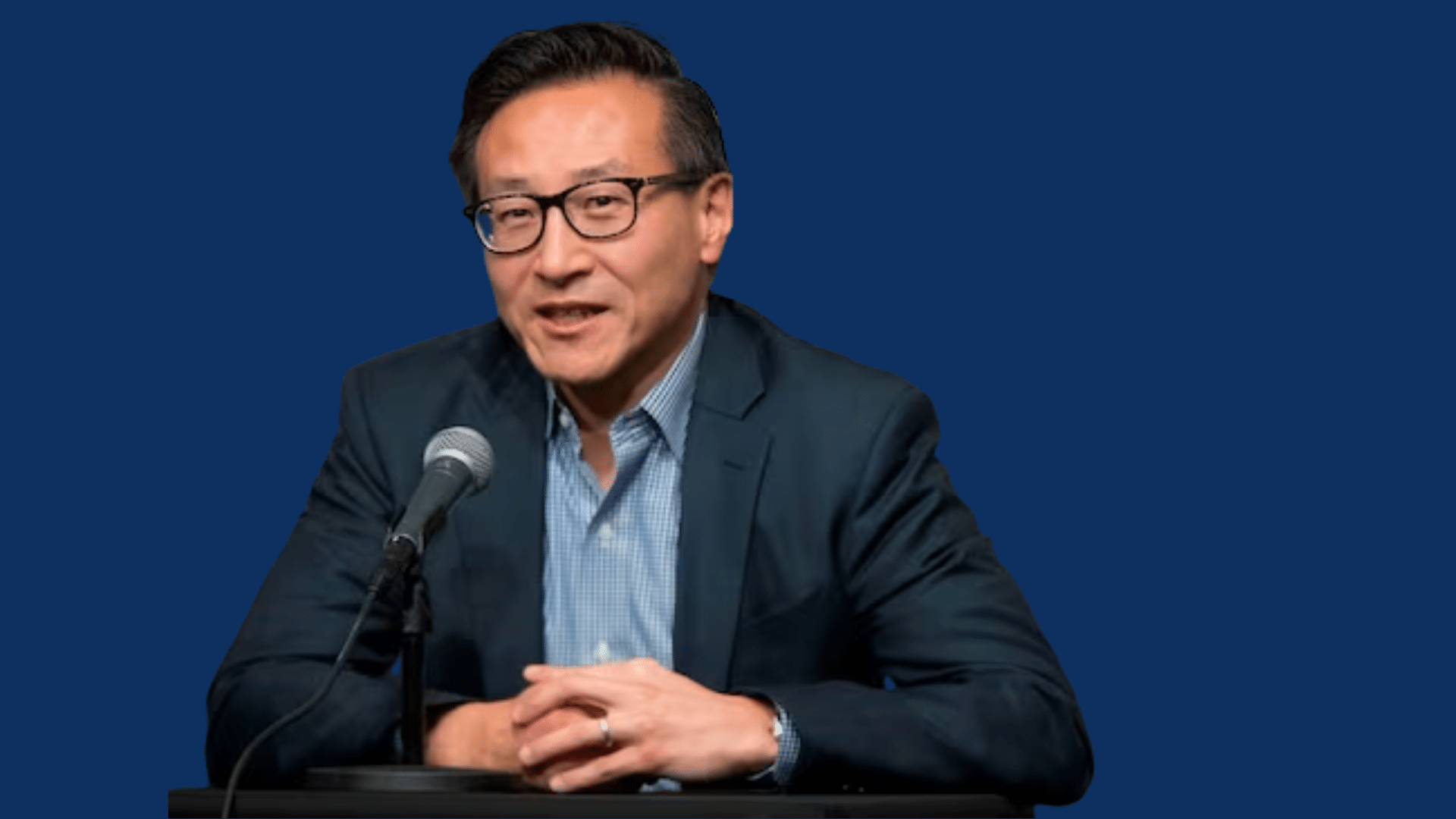 joe tsai speaking at press conference with microphone in front