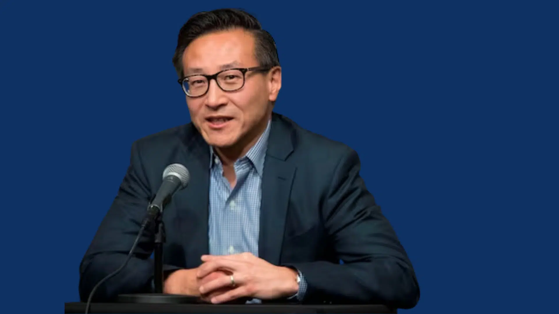 joe tsai speaking at press conference with microphone in front