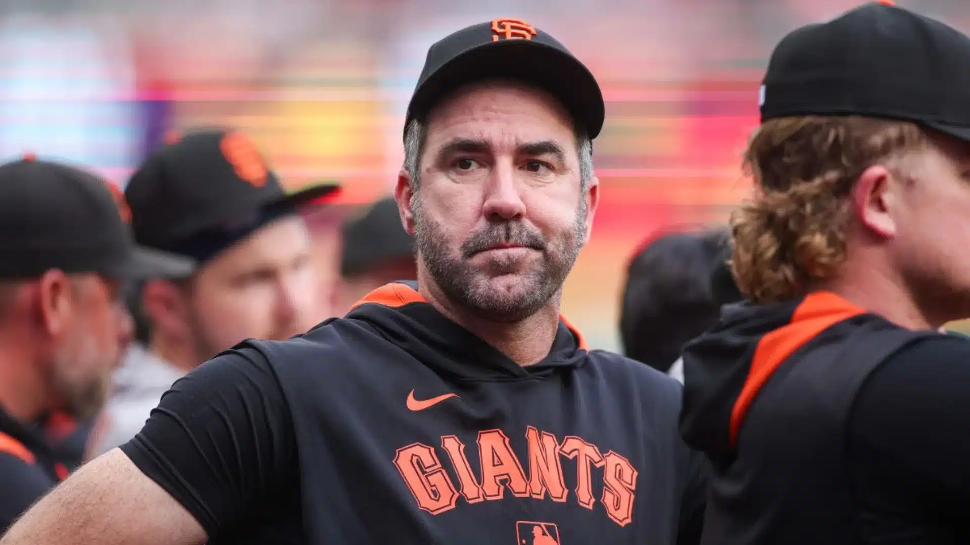 justin verlander one of the oldest active mlb players standing in giants dugout during game with teammates around