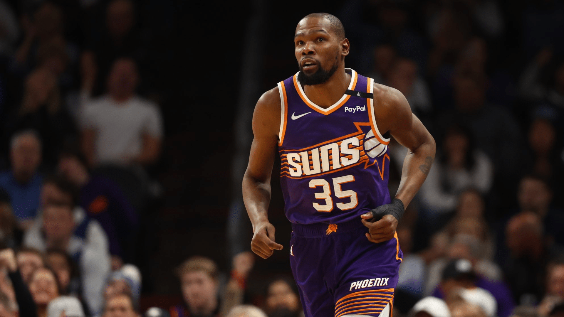 kevin durant wearing a purple phoenix suns uniform widely known for debates about Kevin Durant's real height