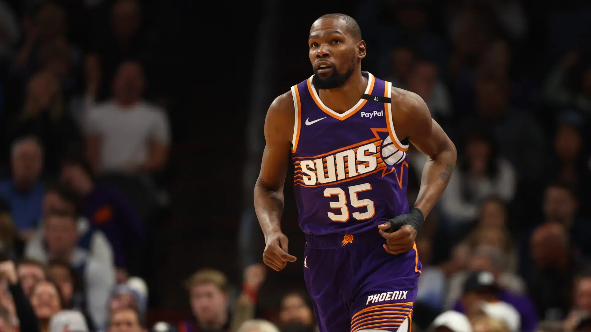 kevin durant wearing a purple phoenix suns uniform widely known for debates about Kevin Durant's real height