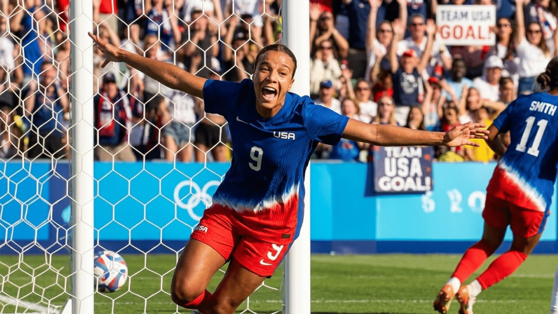 mallory swanson soccer player in usa jersey celebrates goal with arms wide near net as crowd cheers in stadium