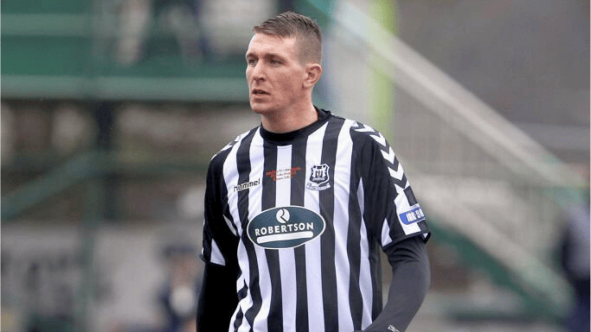 paul millar is wearing a black and white striped kit possibly playing for a Scottish club