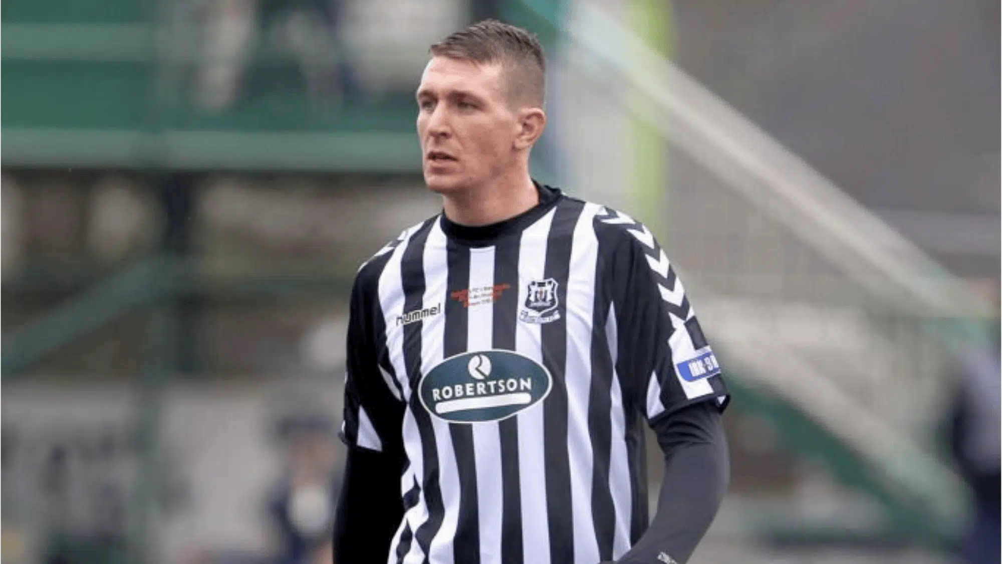 paul millar is wearing a black and white striped kit possibly playing for a Scottish club