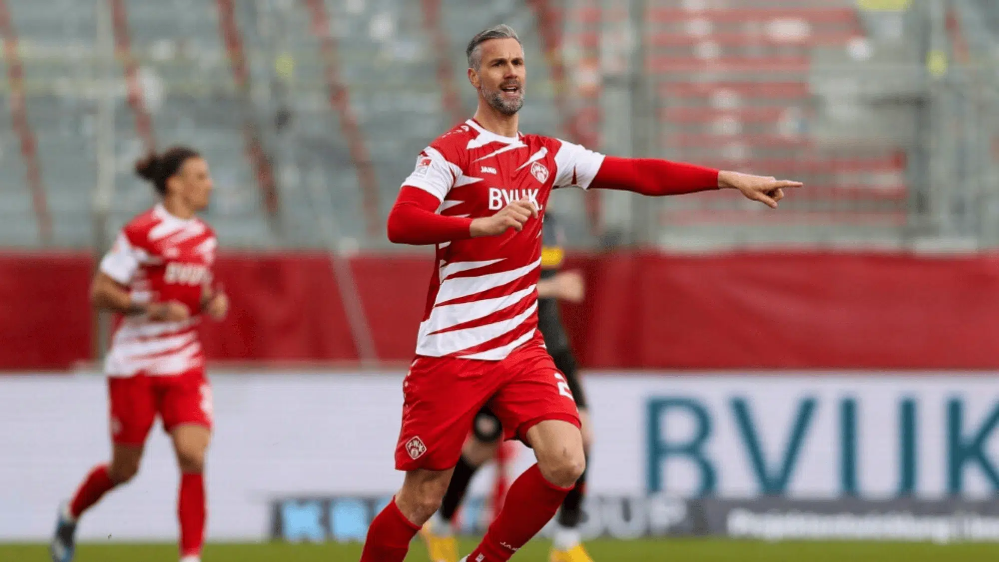 stefan maierhofer in a red and white striped kit likely playing for a team in the Bundesliga