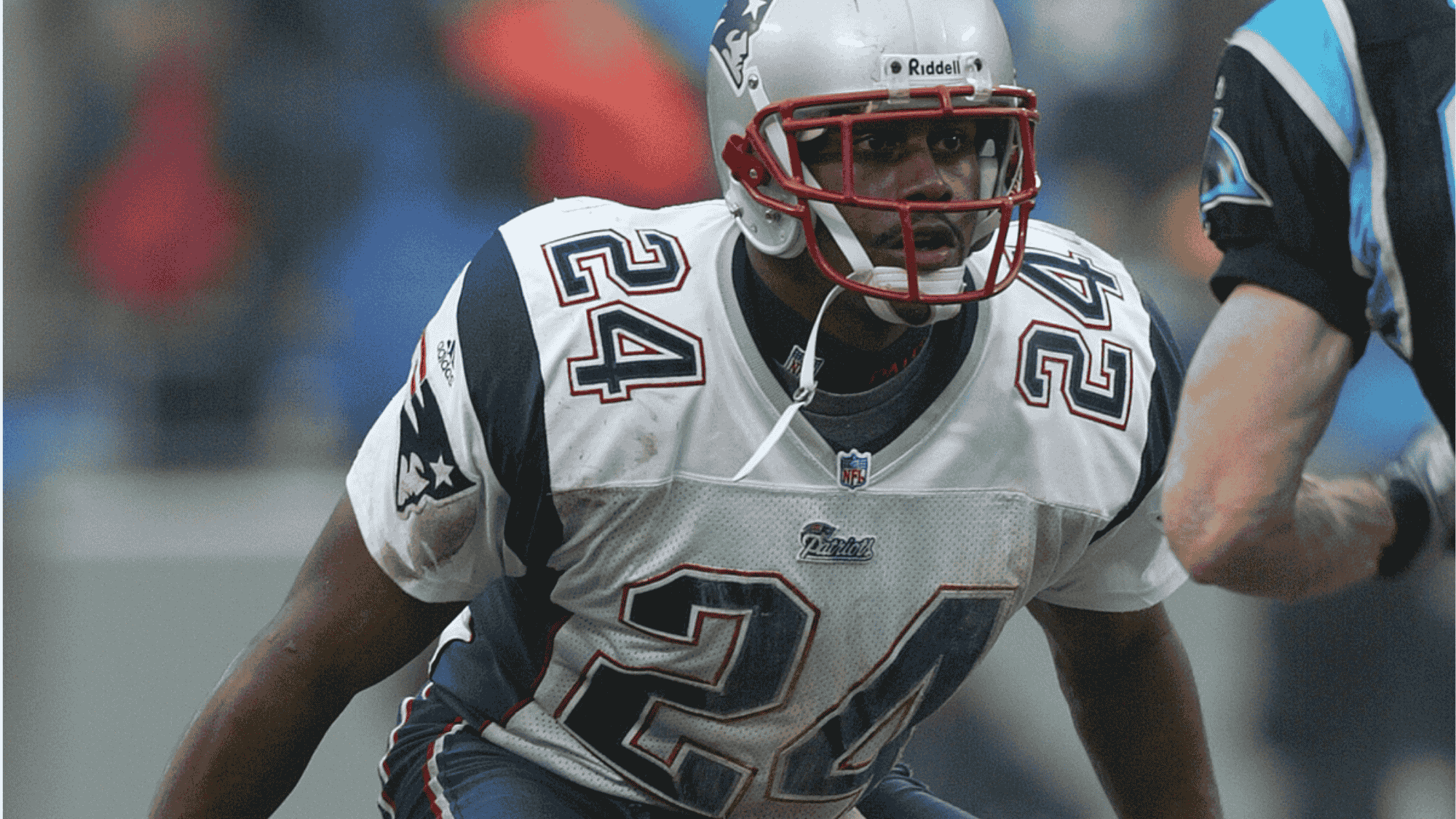 ty law in a new england patriots jersey number 24 with a focused expression prepares for action