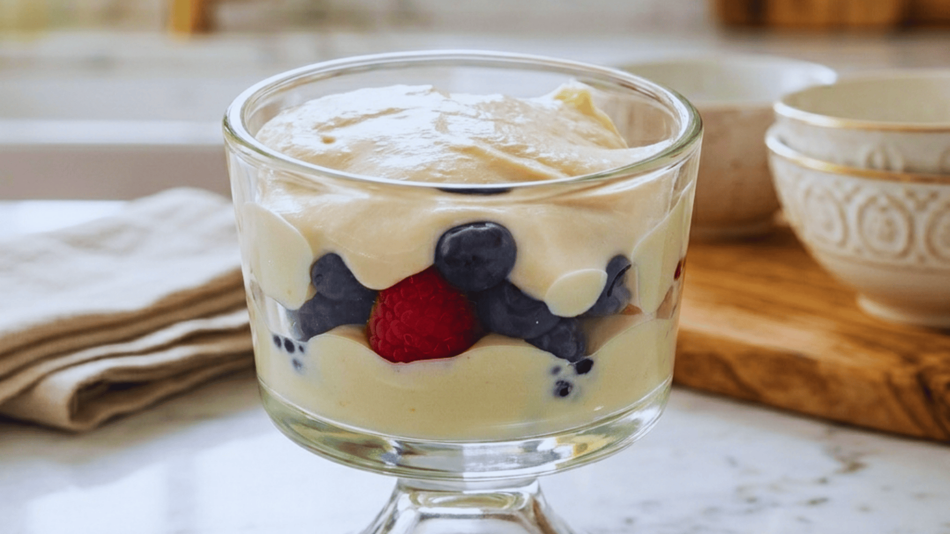 Low-Fat Ricotta with Fruit like berries in a glass dessert cup