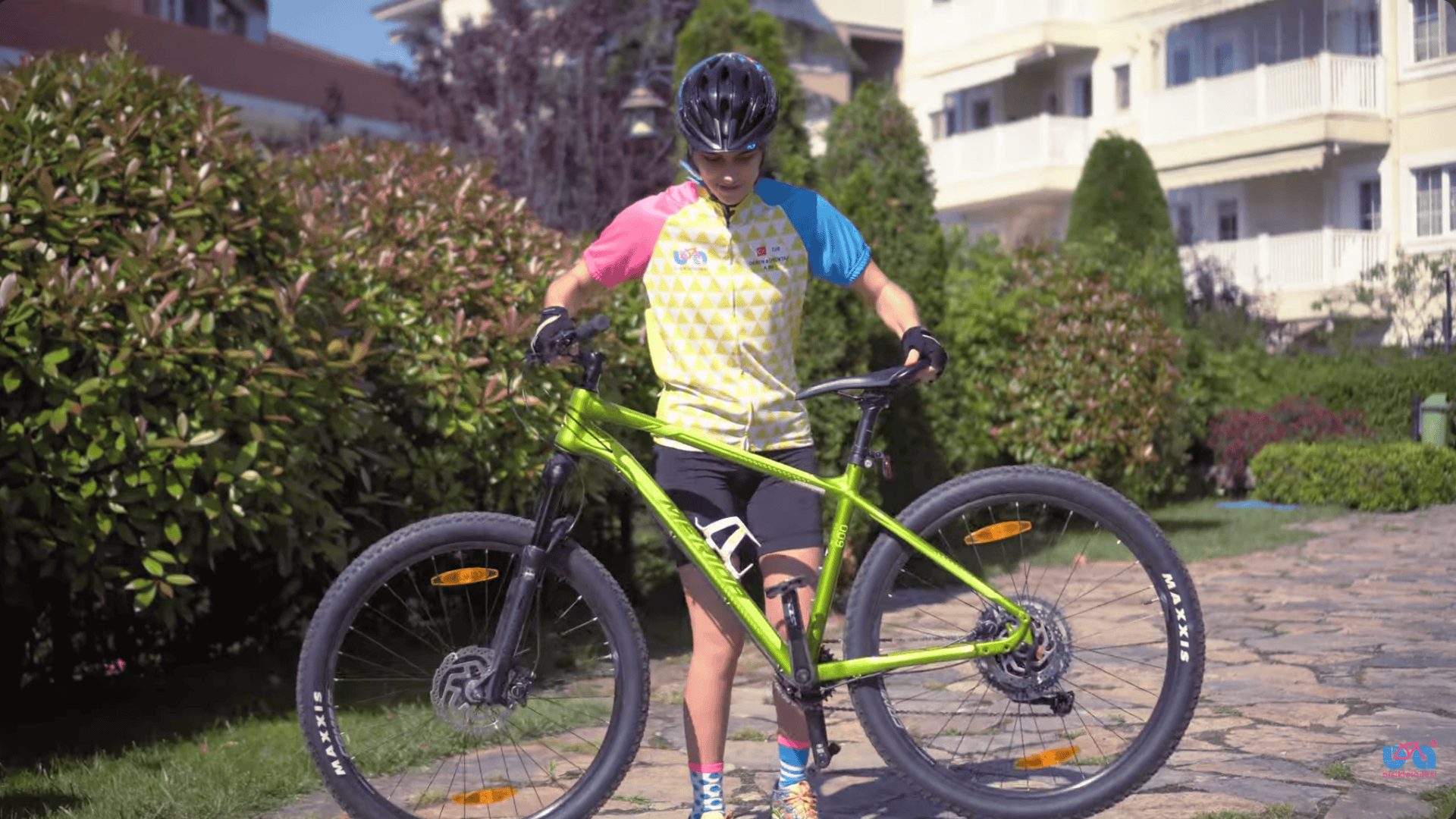 adjusting bike saddle height so toes can touch ground for better balance and control