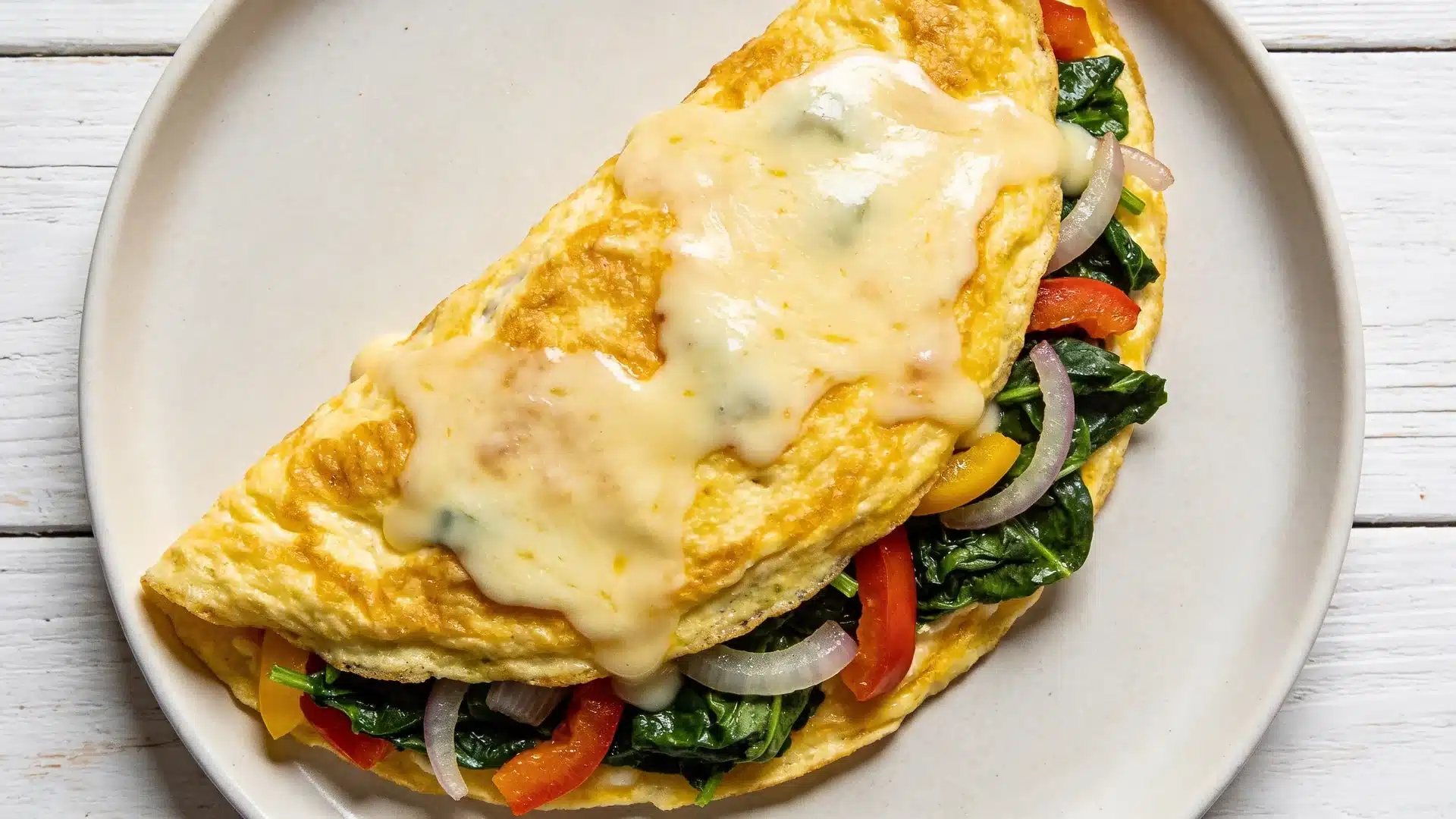 egg omelet with veggies and melted cheese perfect for high protein snacks weight loss and healthy meals