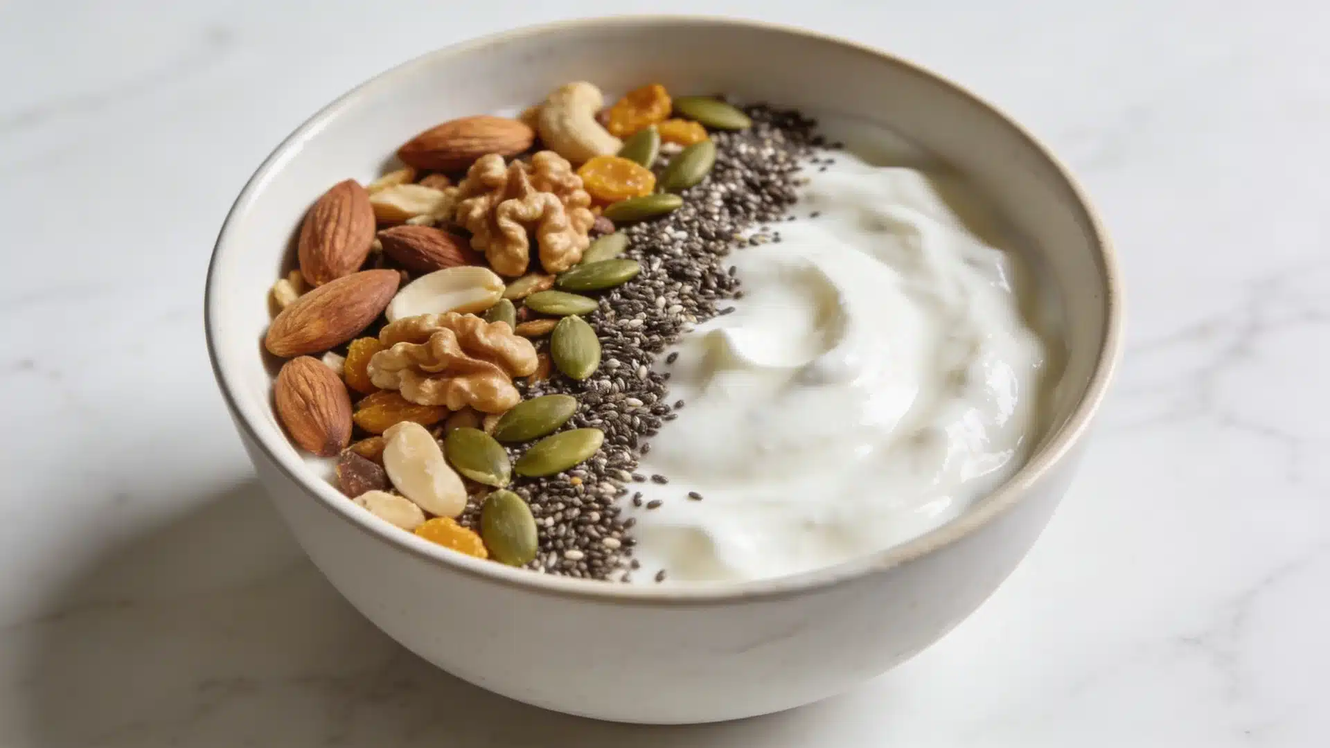 greek yogurt bowl with nuts and seeds perfect for high protein snacks weight loss and healthy eating