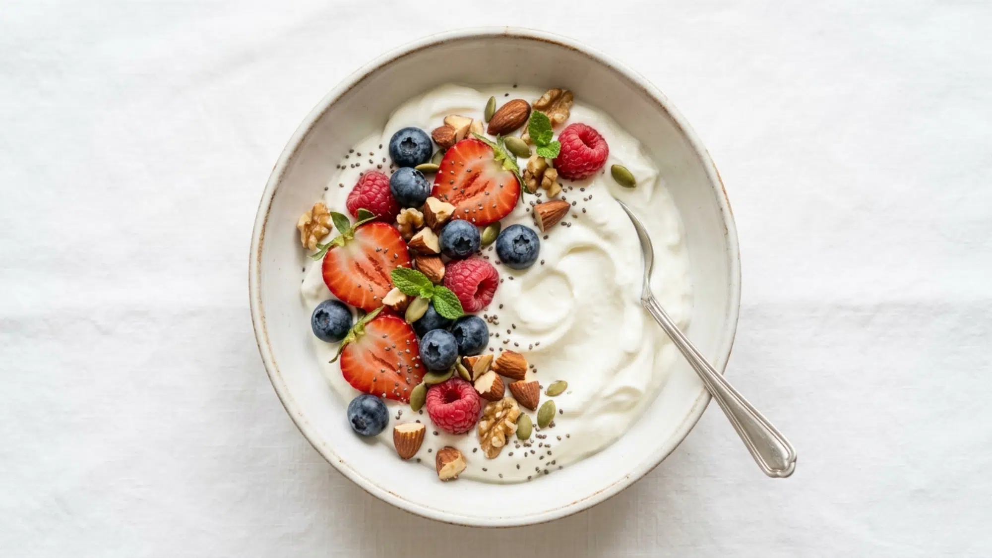 greek yogurt with berries and nuts bowl perfect for high protein snacks weight loss and healthy eating