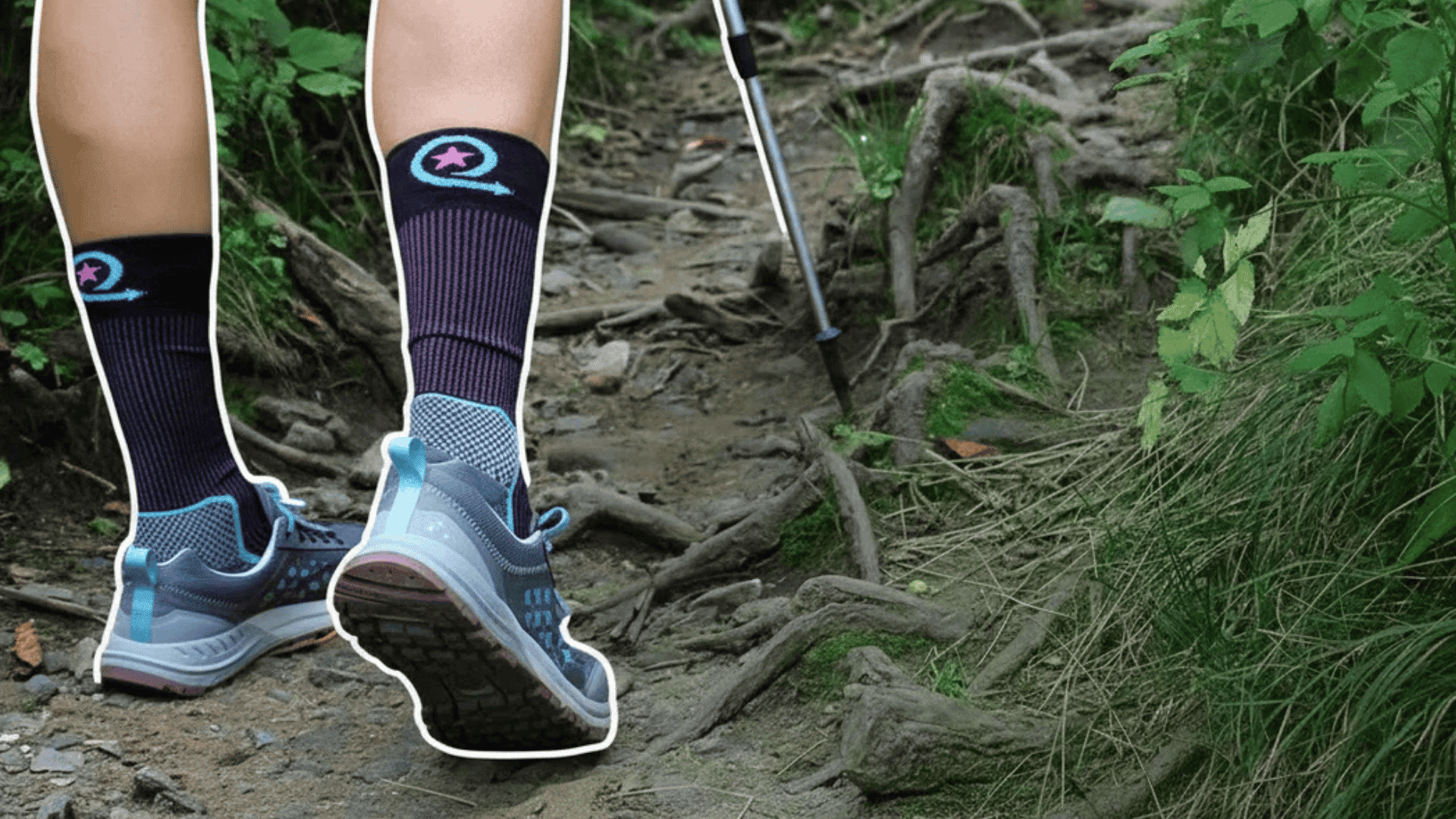 person hiking on dirt trail with roots wearing athletic shoes and patterned socks using walking pole in forest setting