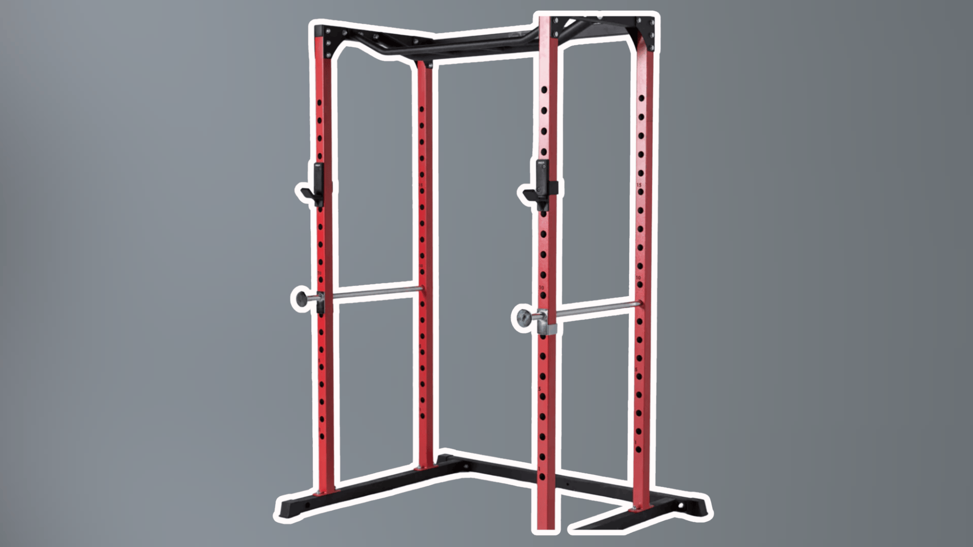 red metal squat rack with adjustable safety bars and pull up bar isolated on plain gray background