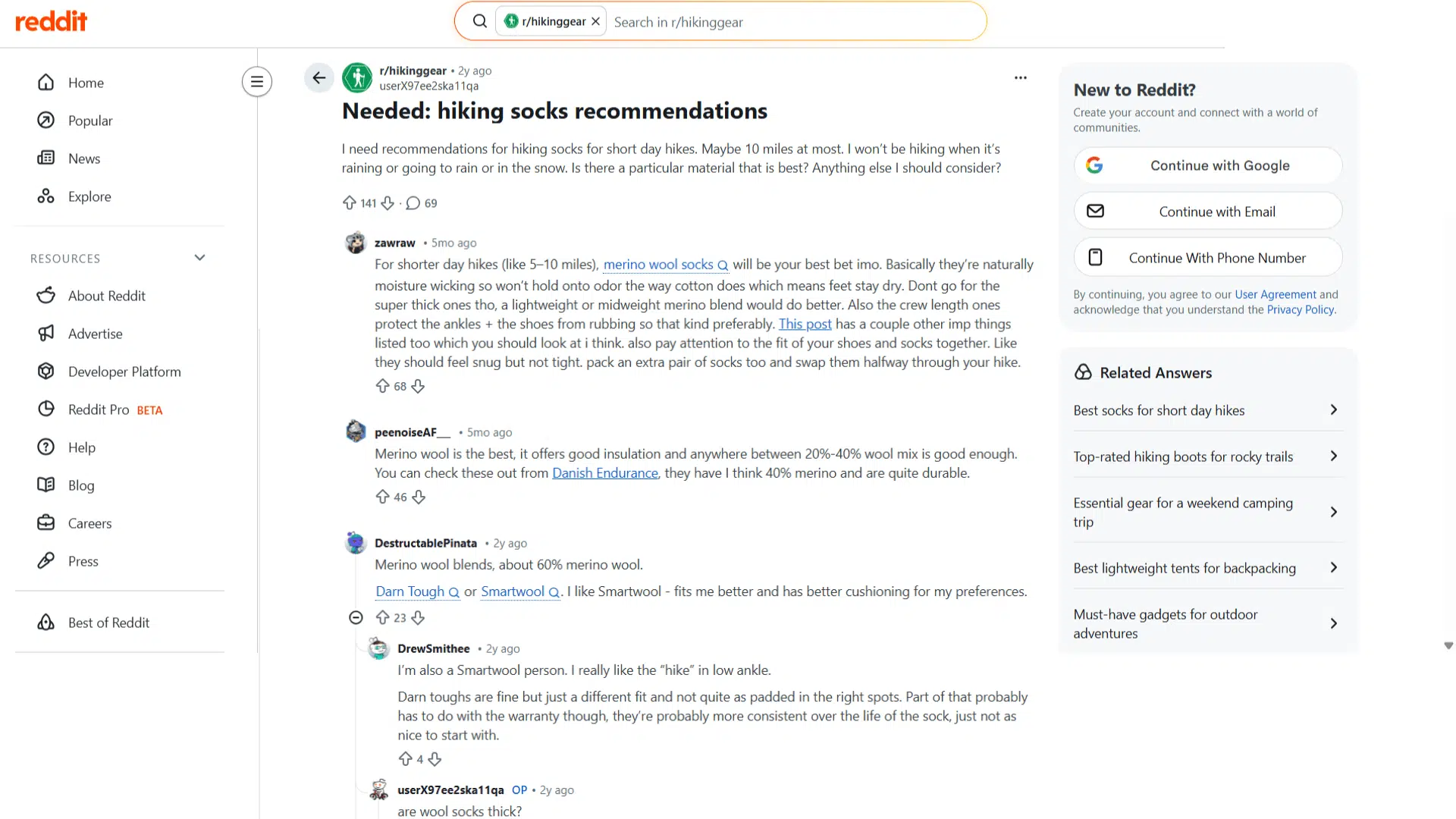 reddit page showing a post asking for hiking socks recommendations with user comments discussing merino wool and sock brands