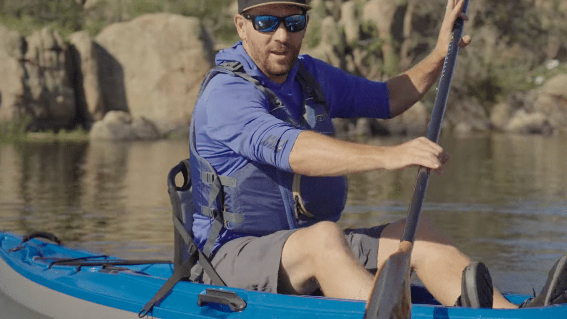 reverse paddle stroke in a kayak pushing water forward with the blade to slow down and stop