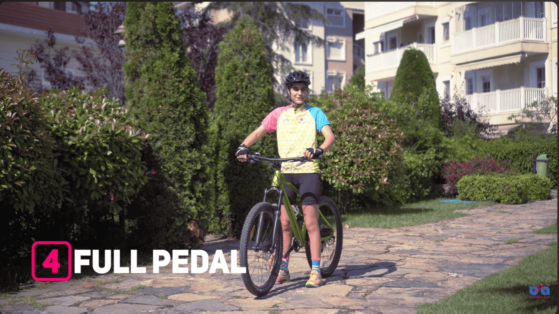 riding bike with both pedals while looking ahead and maintaining smooth balance