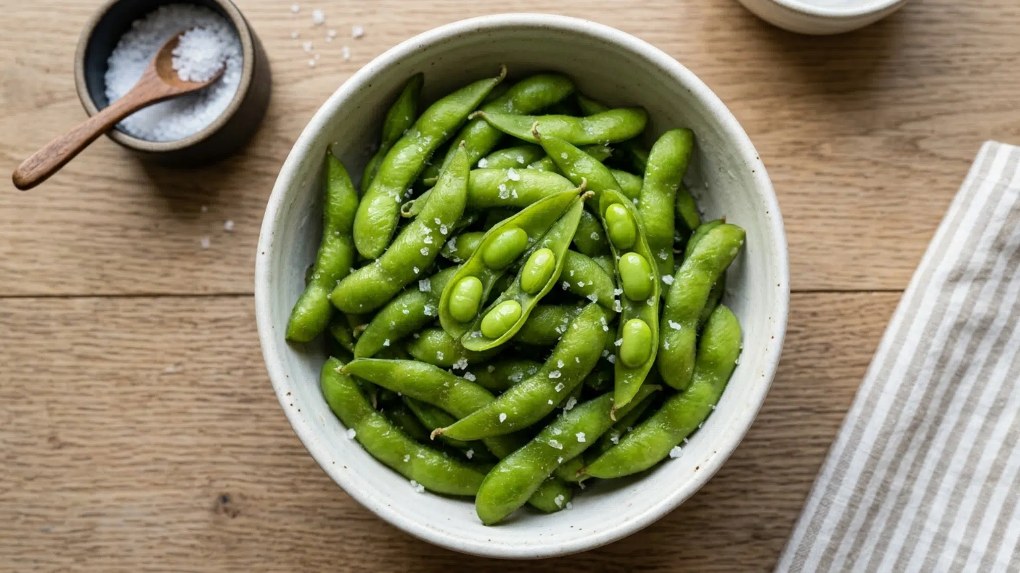 steamed edamame in a bowl with sea salt ideal for high protein snacks weight loss and clean eating
