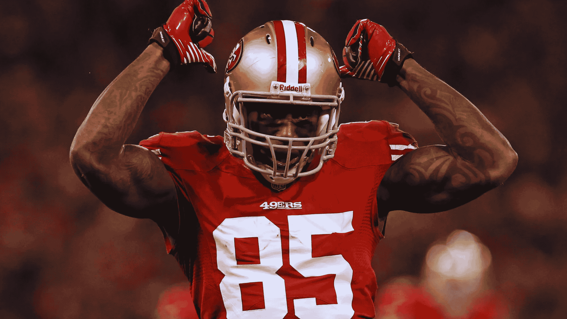49ers vernon davis in number 85 flexes both arms after successful play under stadium lights