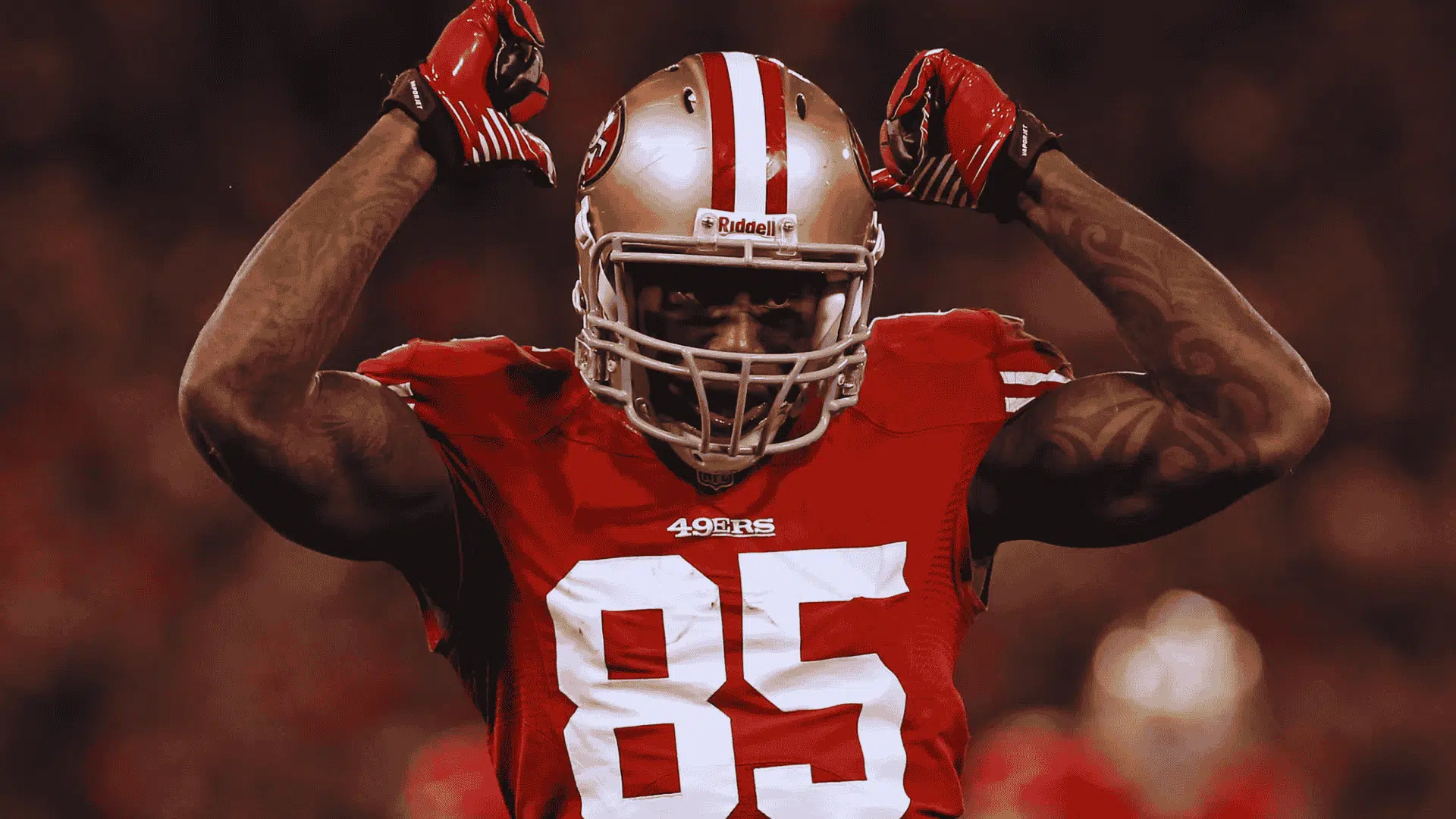49ers vernon davis in number 85 flexes both arms after successful play under stadium lights