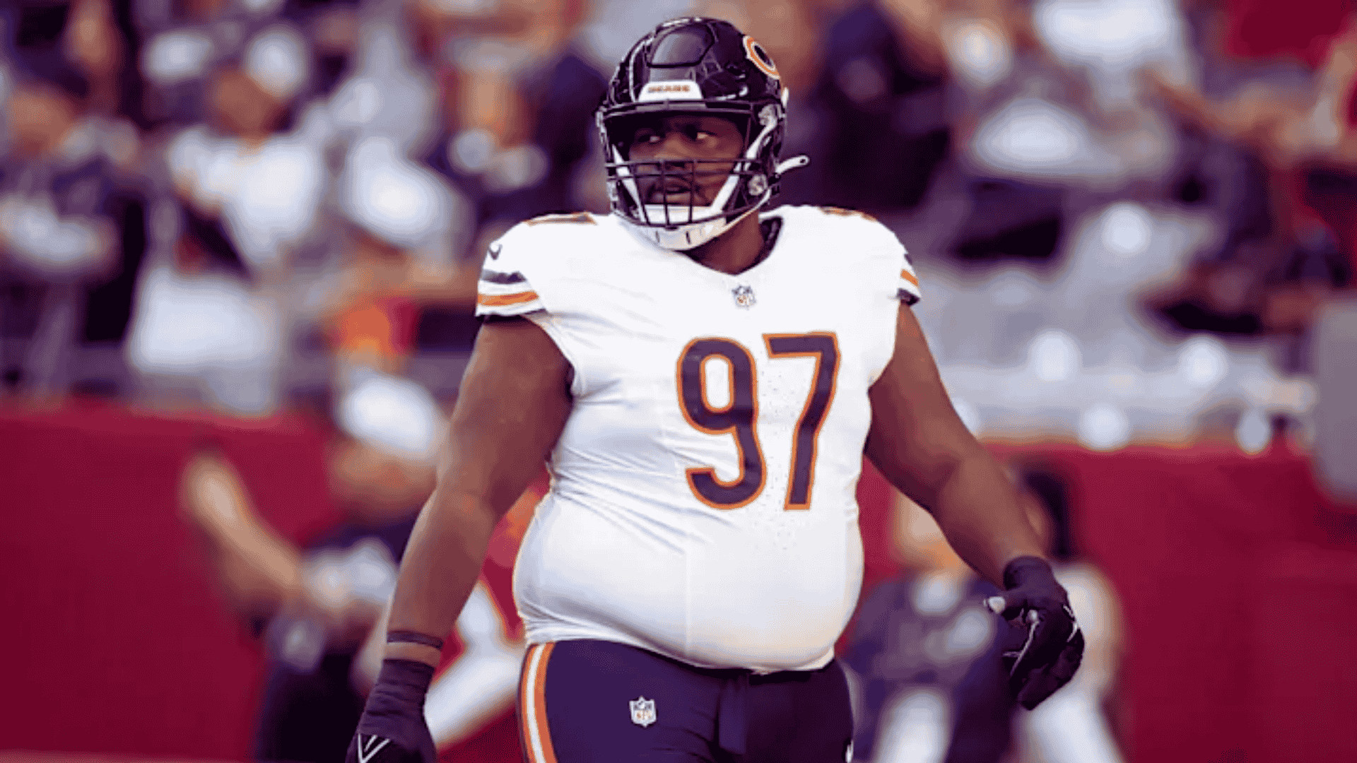 bears defensive lineman andrew billings in number 97 walks on field with fans behind him