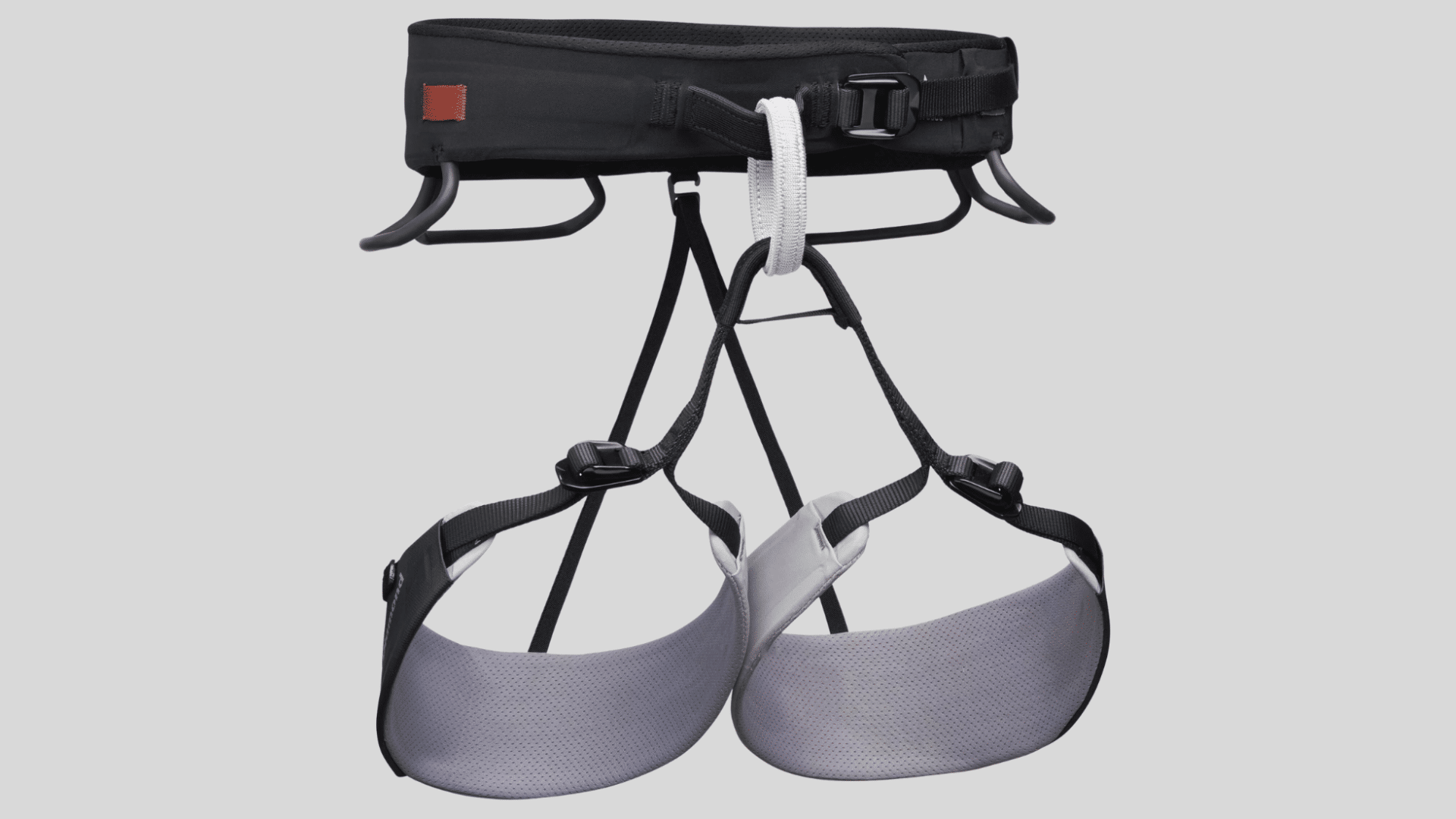 black and gray climbing harness with adjustable leg loops and waist belt for secure fit and support on a clean background